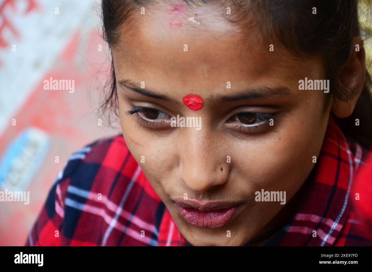 Face of nepali girl posing portrait between use henna ink write drawing
