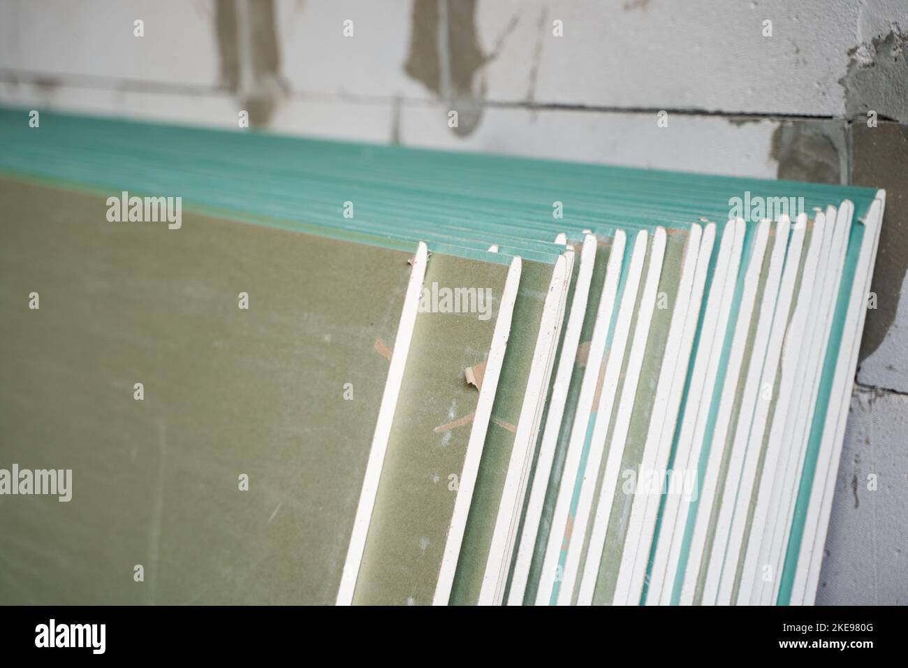 Folded sheets of moisture-resistant drywall close-up. Building
