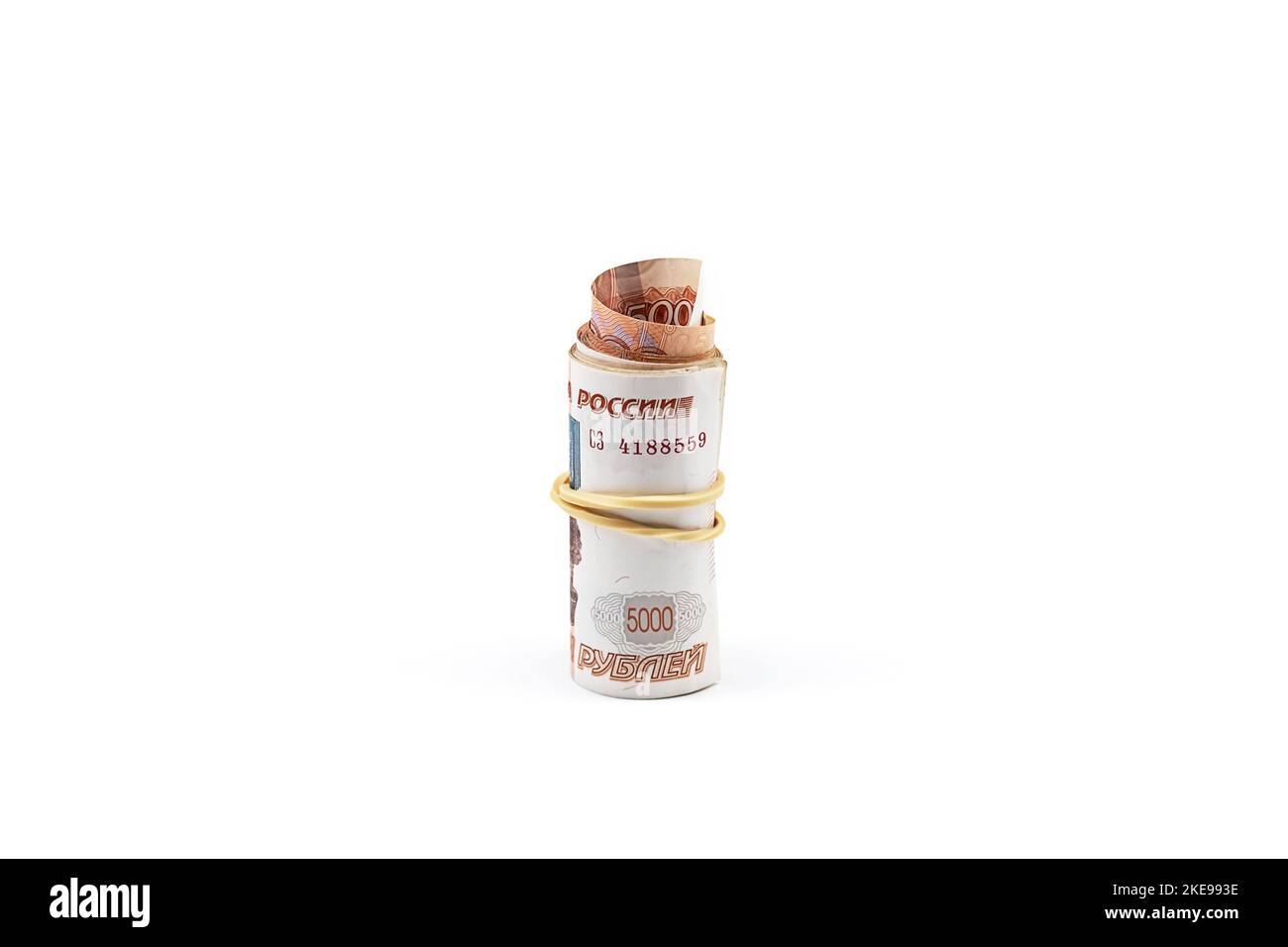 Rolled up five thousand rubles bills on white. Roll of Russian currency