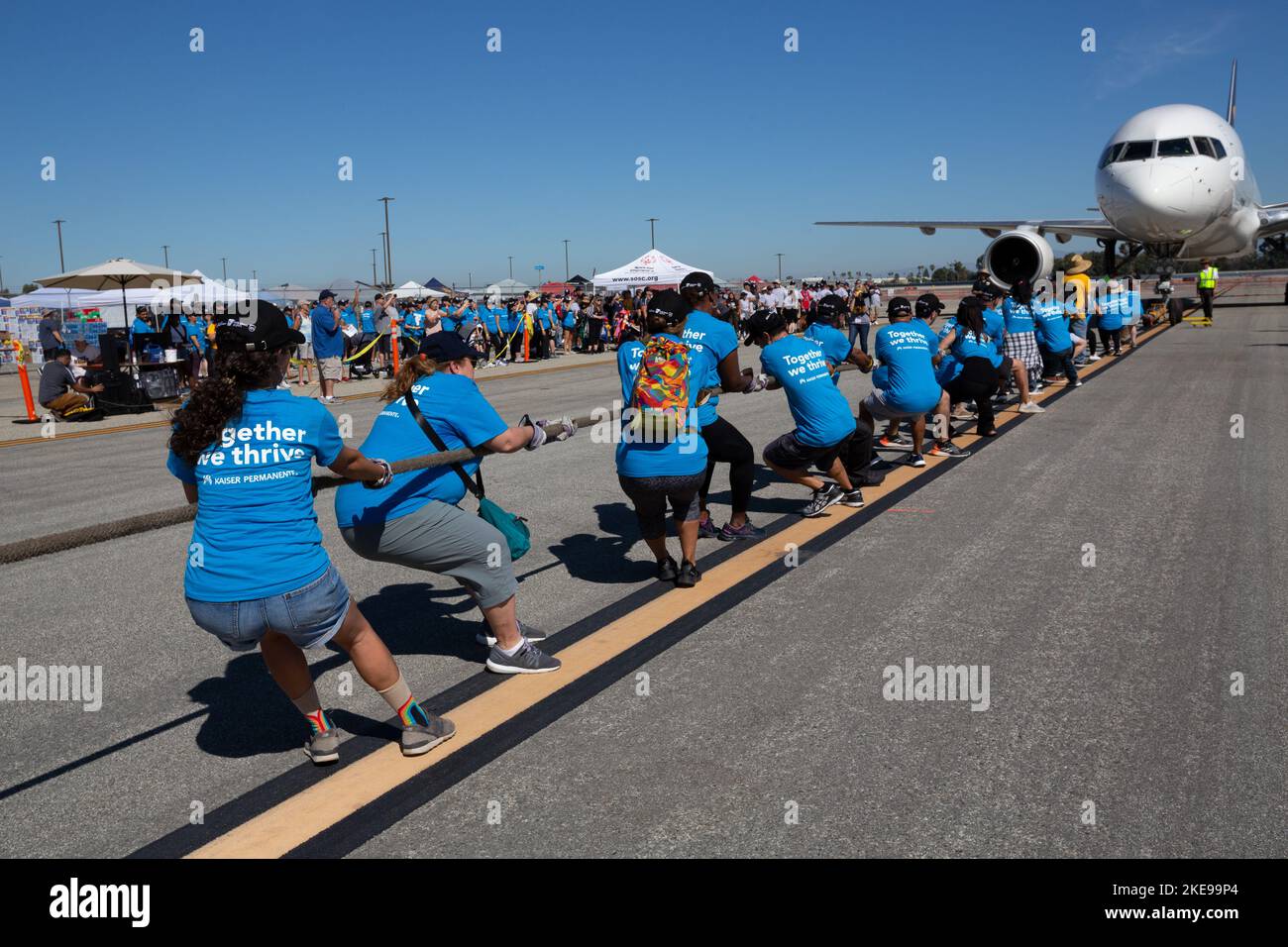 The Kaiser Permanente Team pulling a UPS airplane at the Special