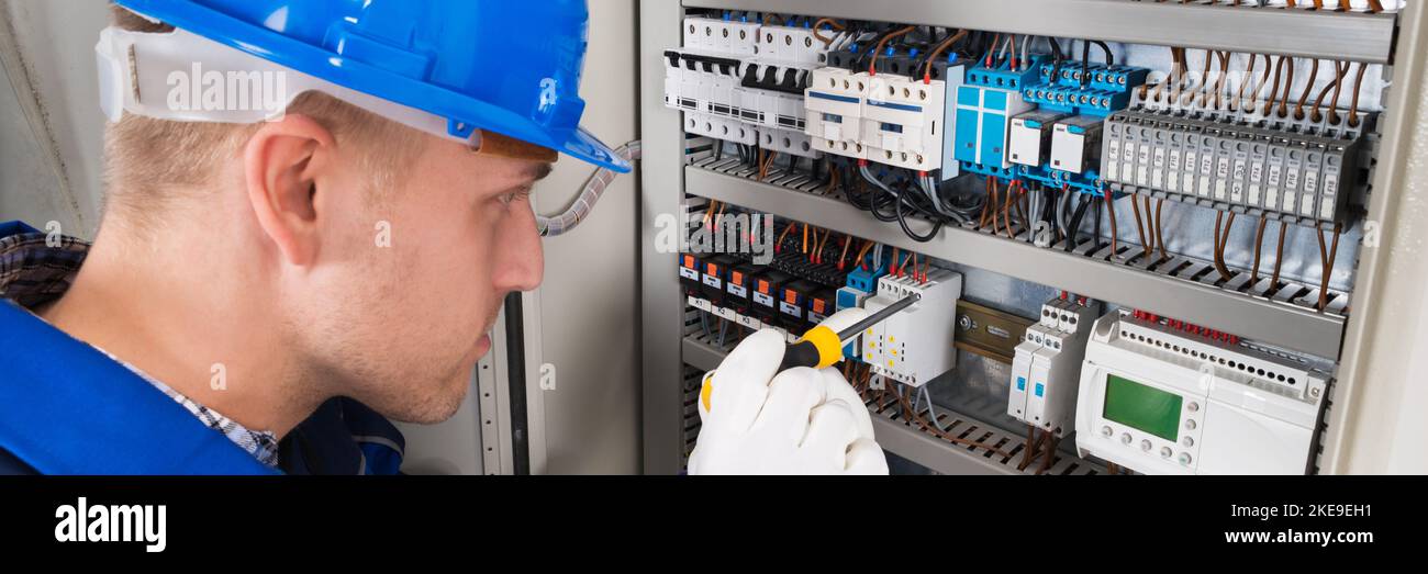 Electrician Worker With Electric Equipment. Repairman Electricity Tester Stock Photo