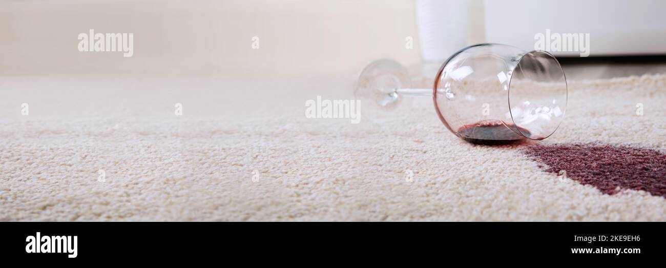Red Wine Spill Stain On Carpet. Spillage Damage Stock Photo