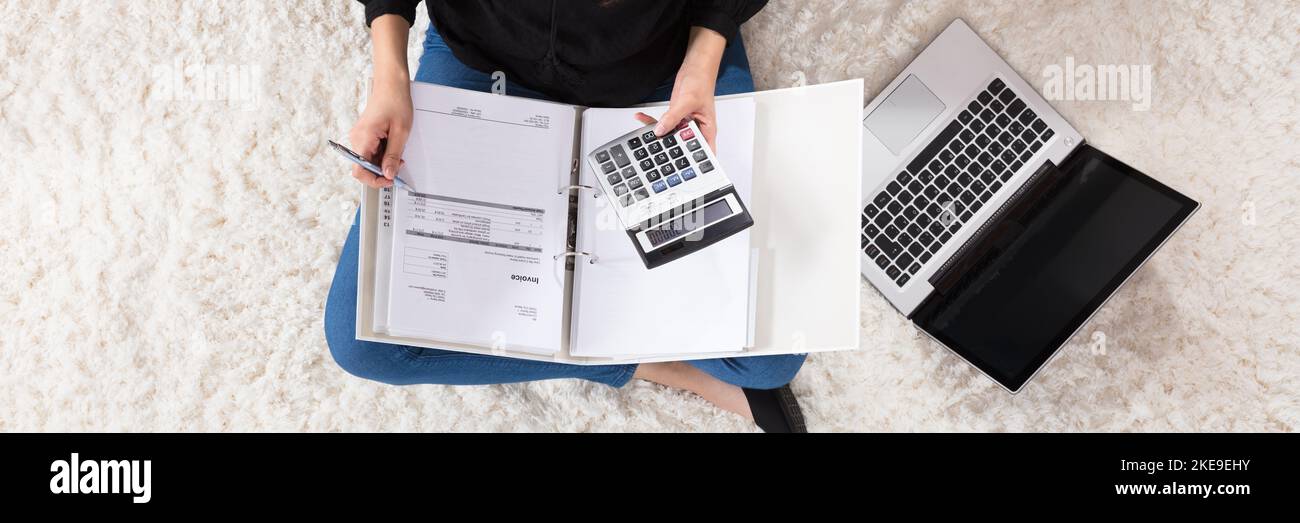 Young Woman Person Calculating Bills Using Calculator Stock Photo