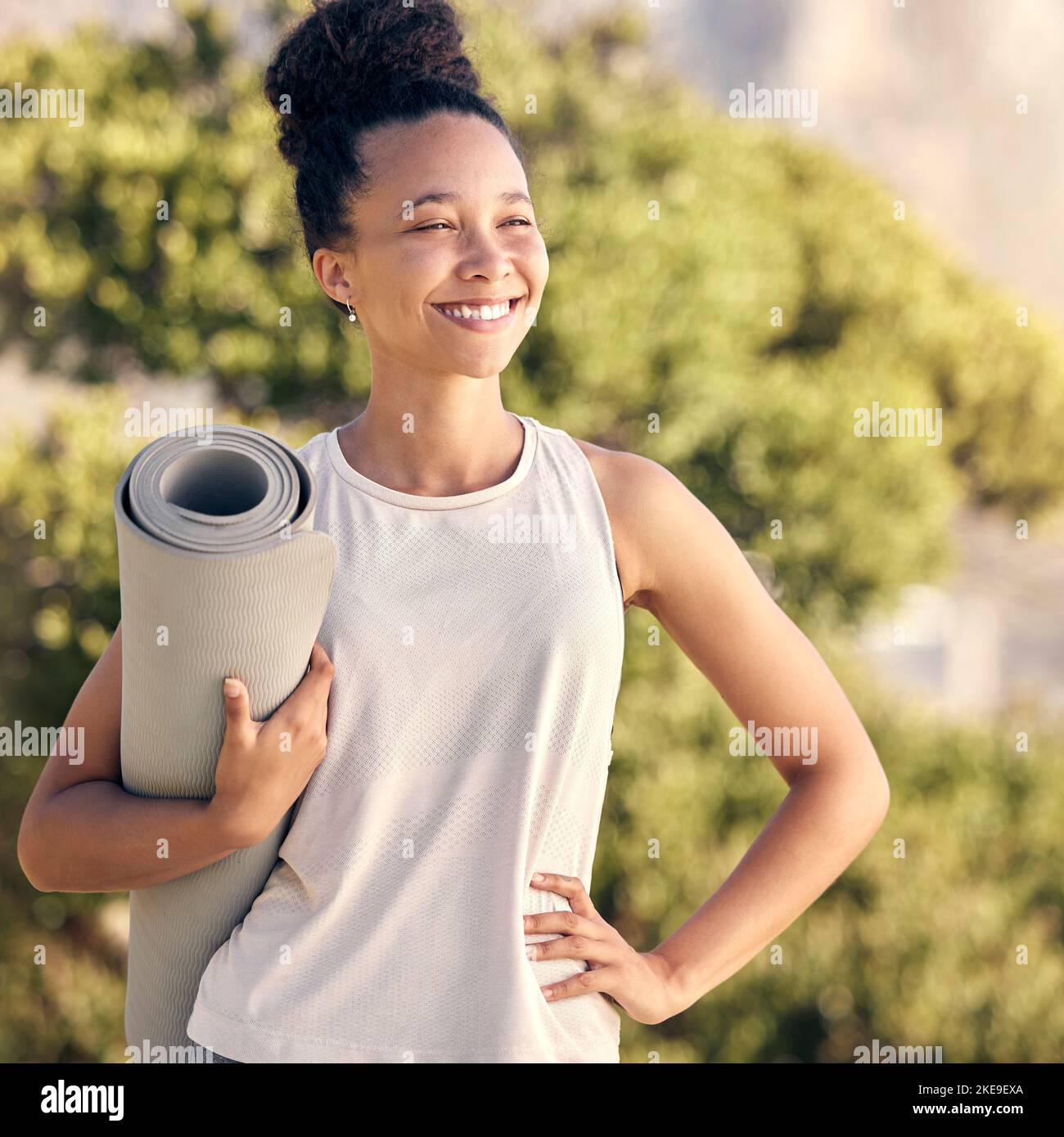 Happy, yoga and zen black woman in nature or park to start pilates training, meditation and breathing exercises. Smile, freedom and healthy girl with Stock Photo