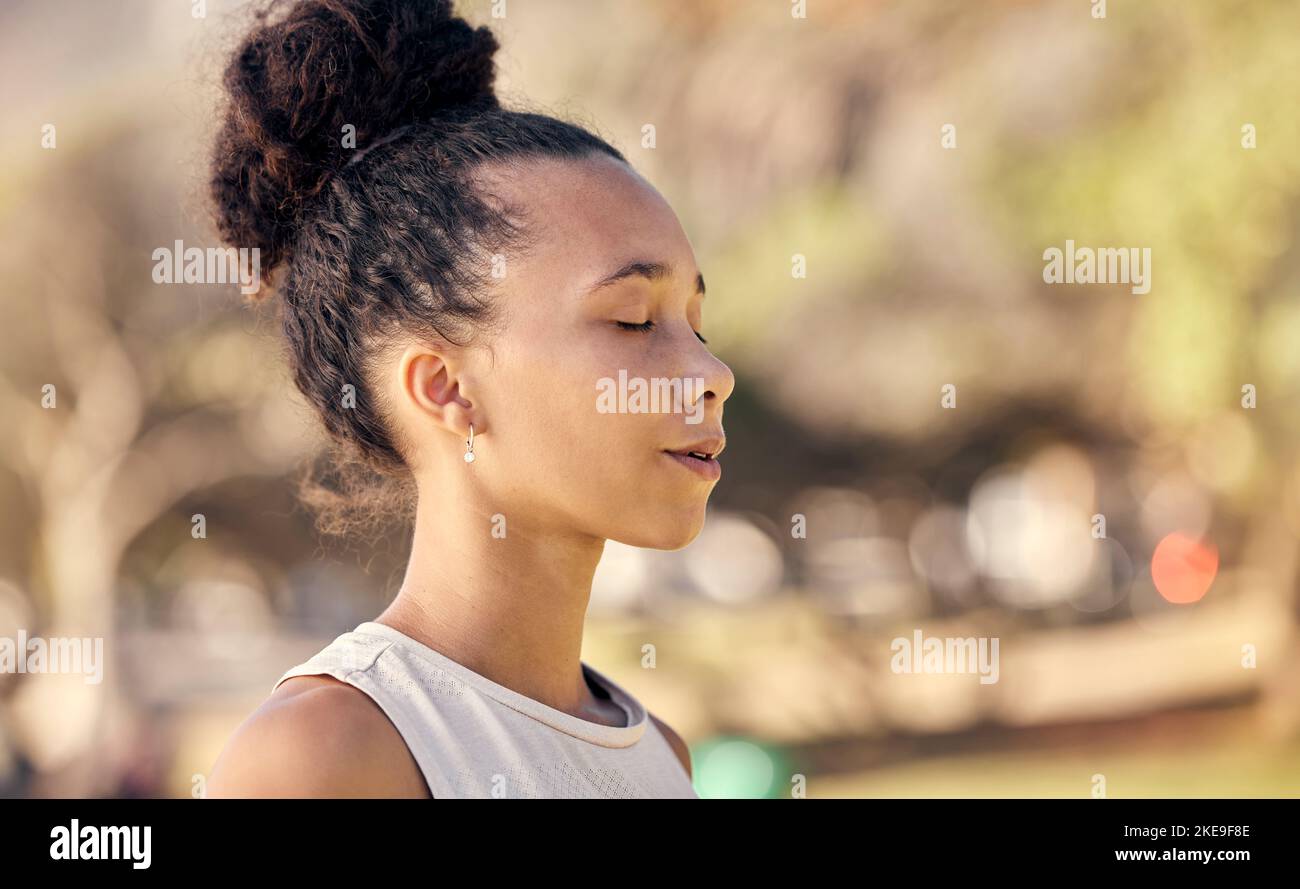 Woman, mediation and yoga with breathing, exercise and zen outdoor in a nature park in spring with peace. Freedom, healthcare lifestyle or relax gen z Stock Photo