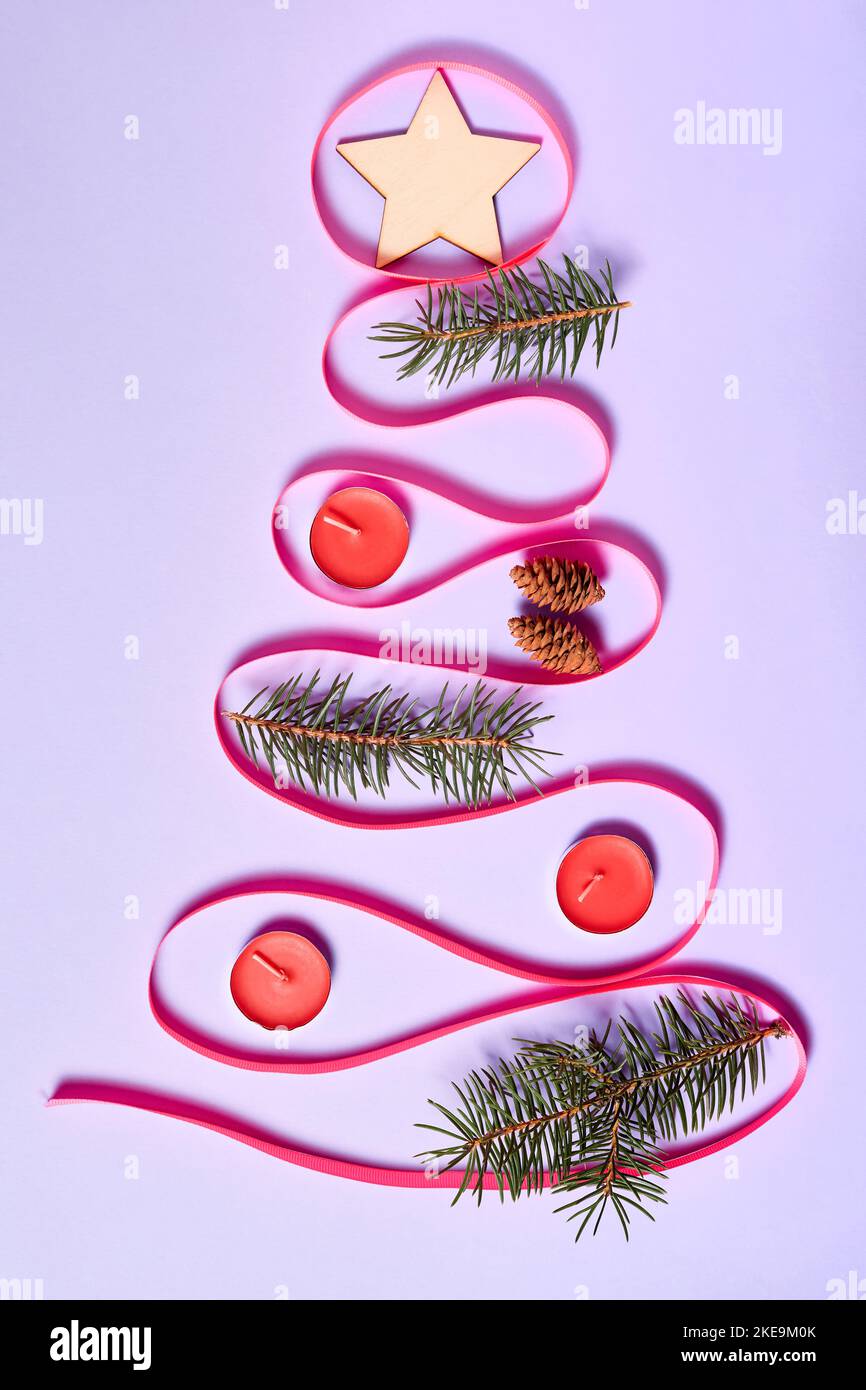 Pink Ribbons Tree Inside Christmas tree made of pink ribbon on purple paper background decorated ...
