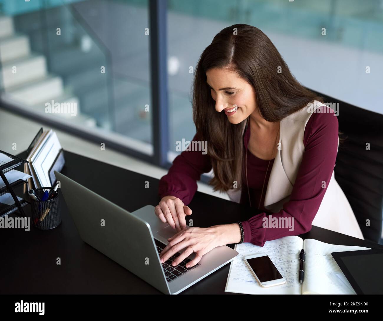 Turning that idea into a viable business model. a businesswoman sitting ...
