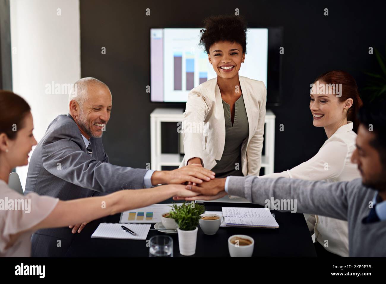 Were moving the company forward together. Portrait of a young businesswoman joining her hands