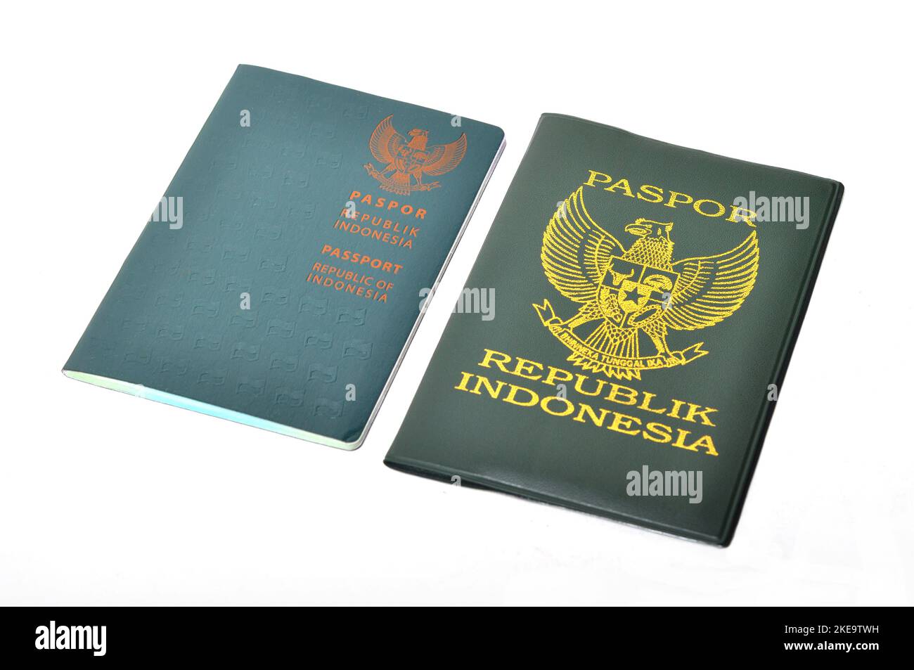 Republic of Indonesia passport book with green cover on white background Stock Photo