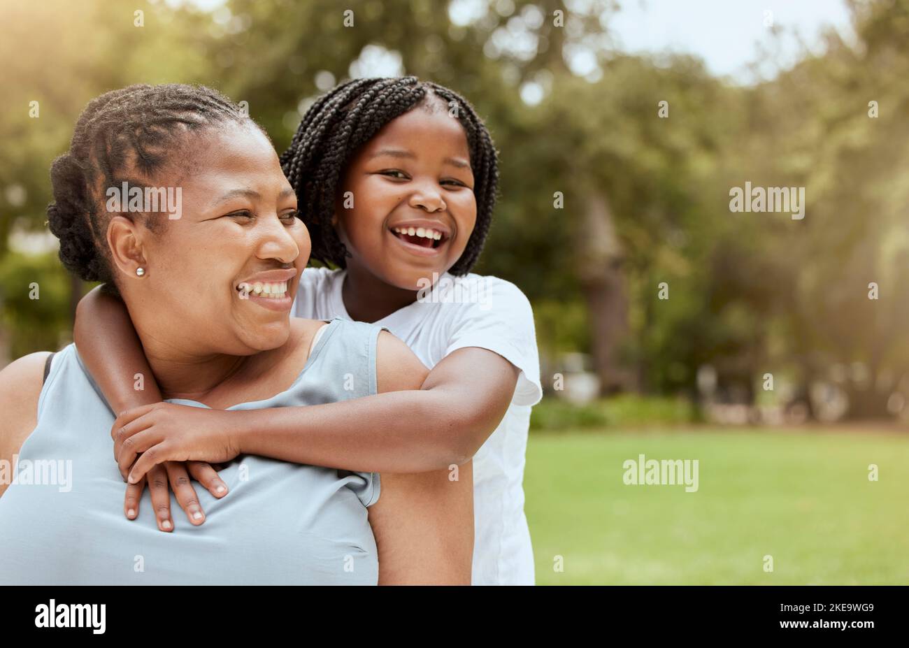 Black family, nature and child hug mother while relax in grass field park for bonding, mockup and quality time together. Love, youth child care and Stock Photo