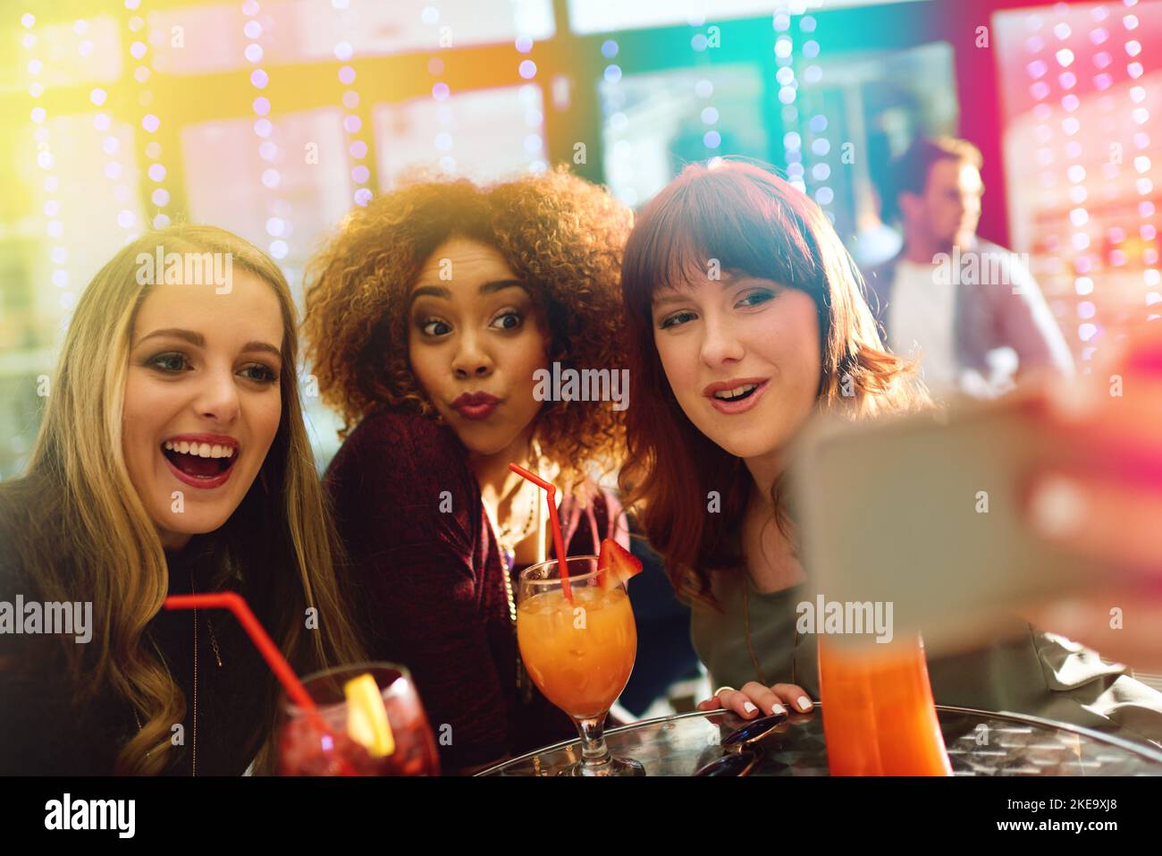 About last night. young friends taking selfies while having drinks at a party. Stock Photo