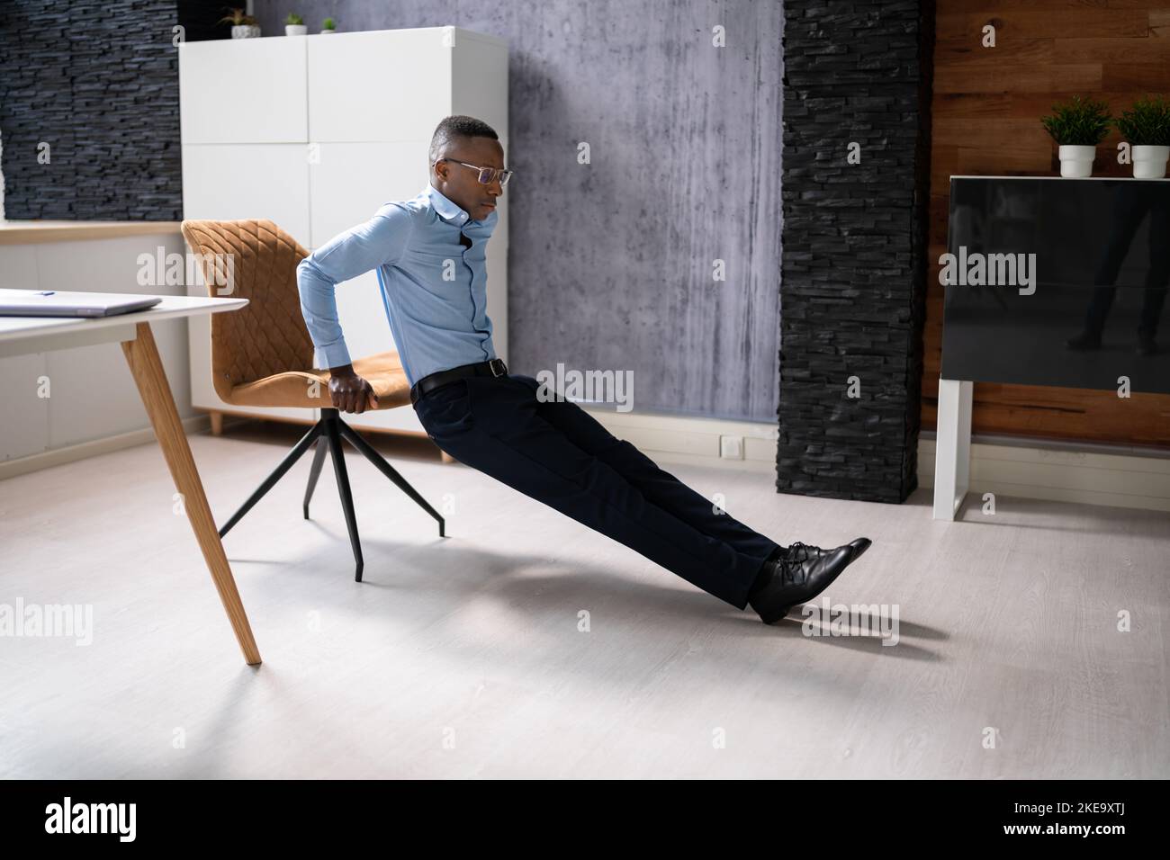 Triceps Dips Chair Exercise At Office Desk Stock Photo