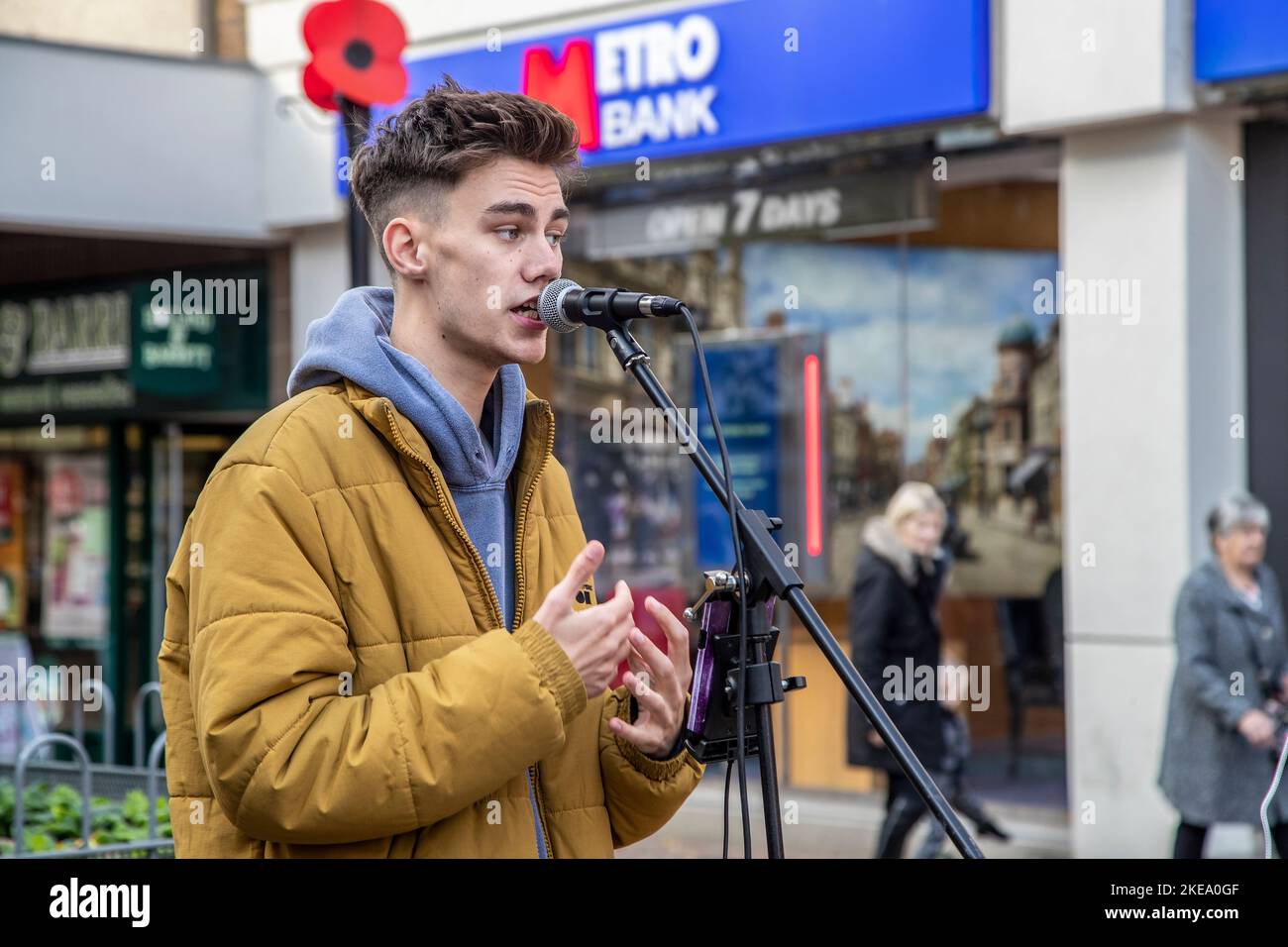 Young lad busking in Abington street, Northampton, England, UK Stock