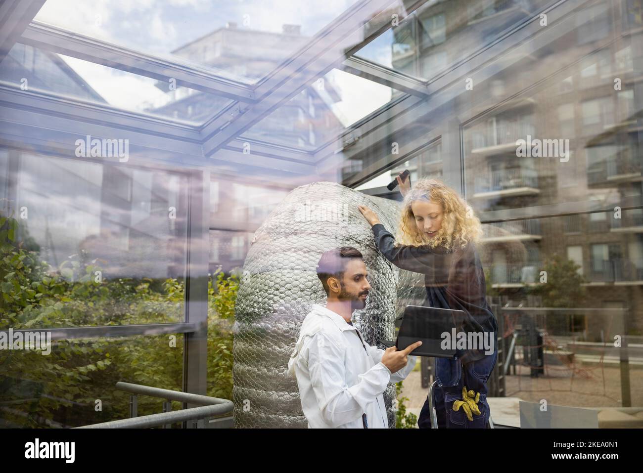 Technicians using digital tablet at work Stock Photo