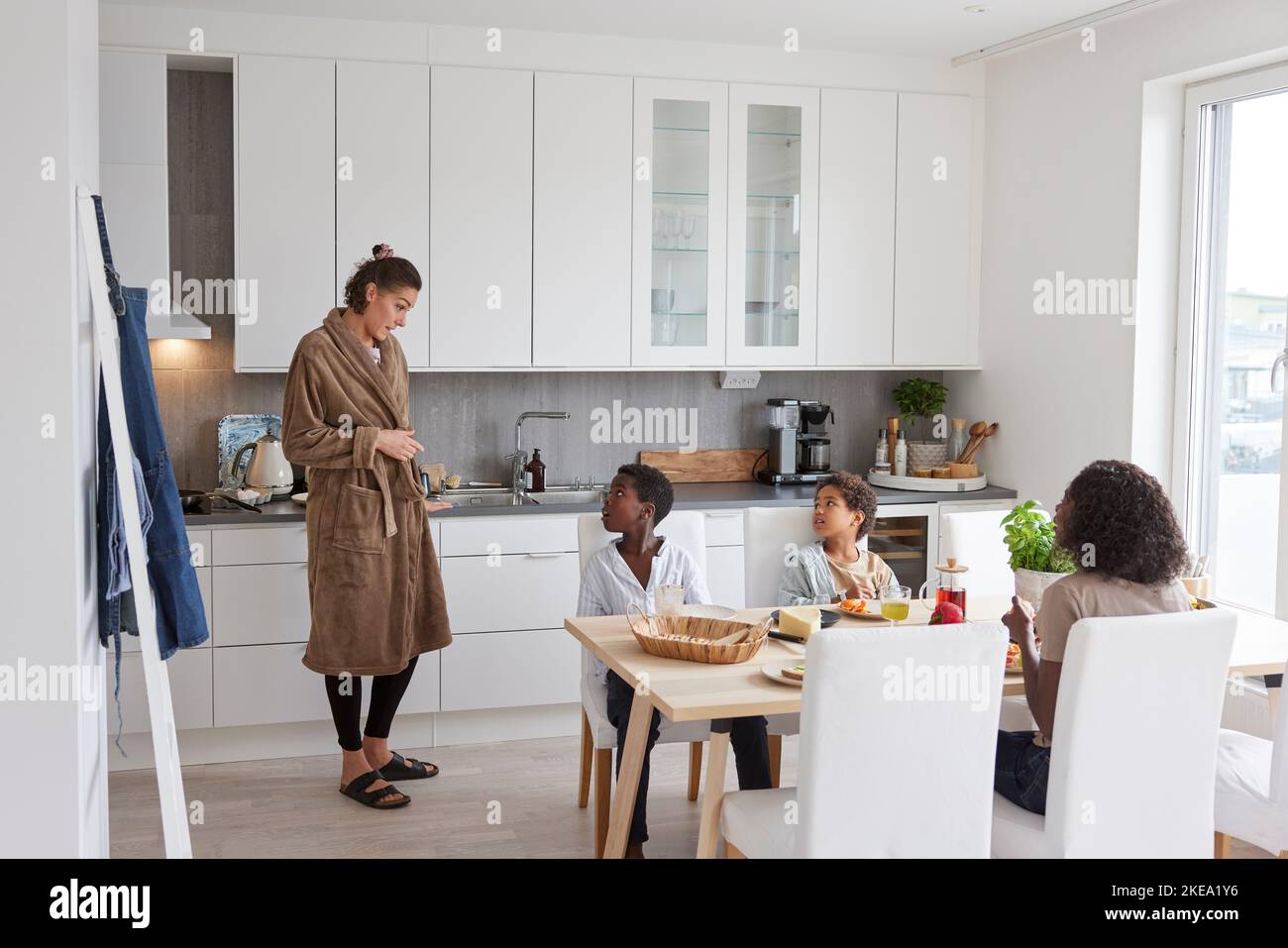 Ethnic family dining table hi-res stock photography and images - Alamy