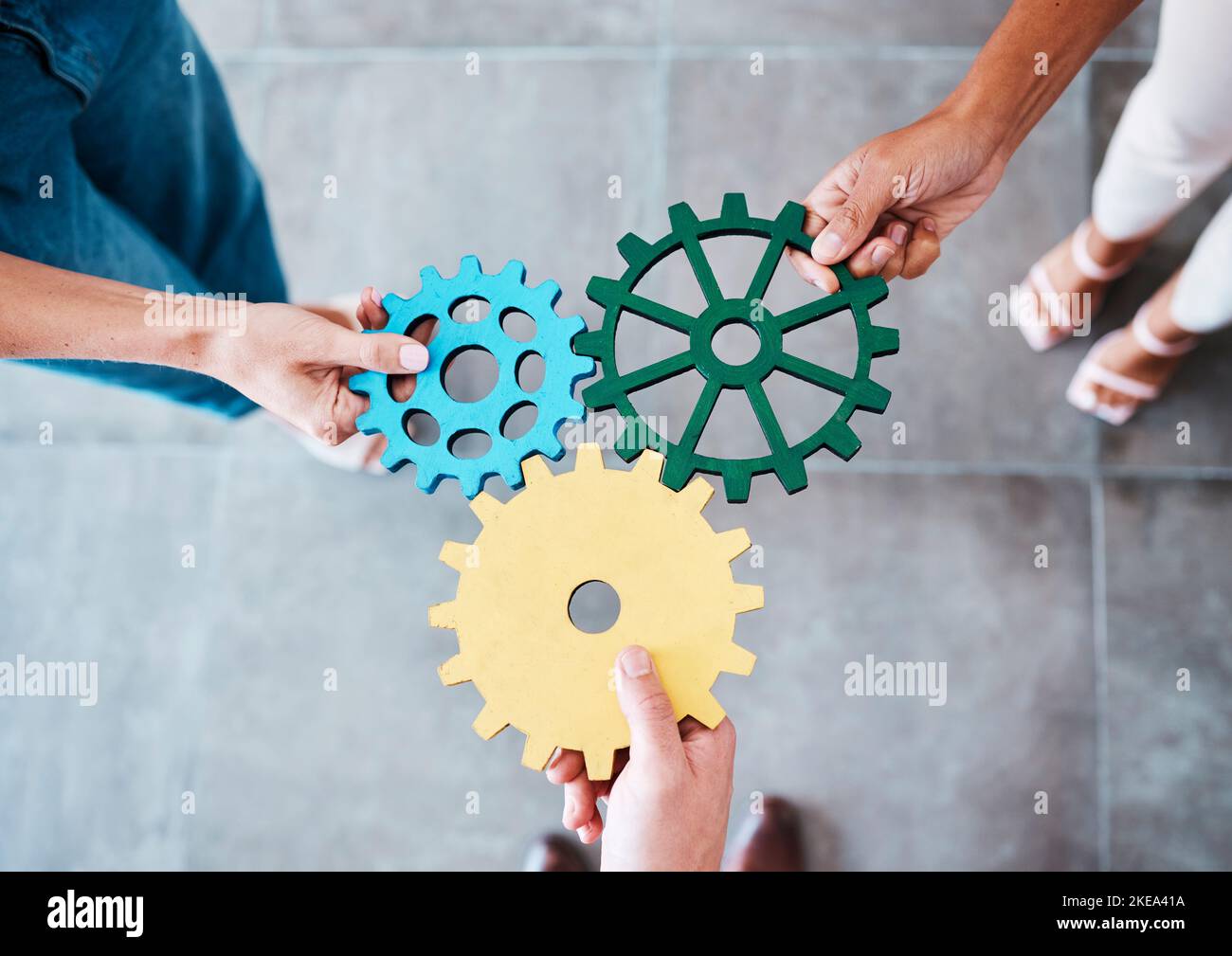 Settings, gear icon and teamwork with business people or team together for collaboration and synergy with cog wheel strategy. Office group hands for Stock Photo