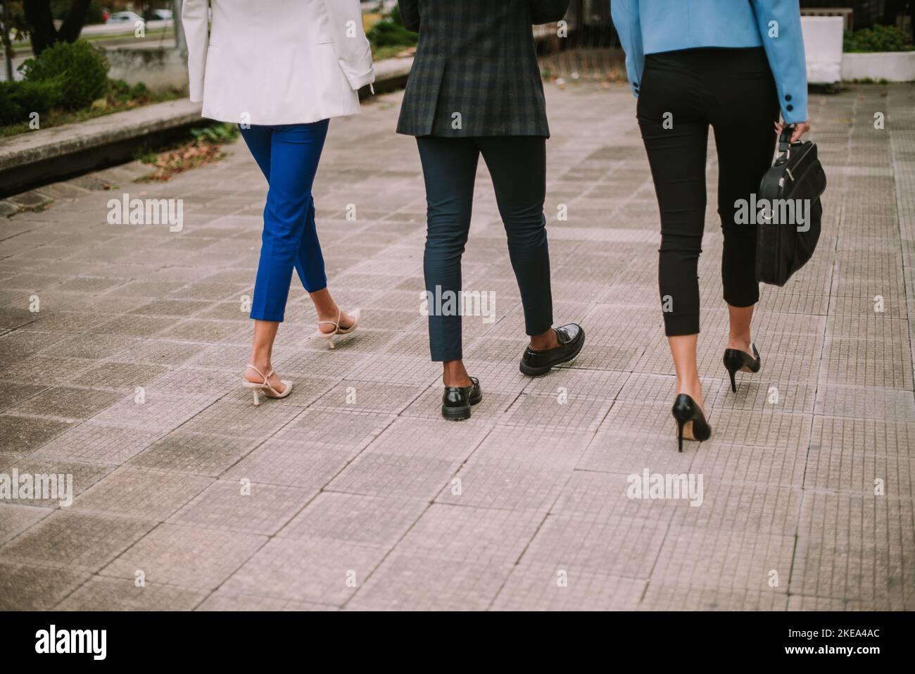 Three business people walking Stock Photo