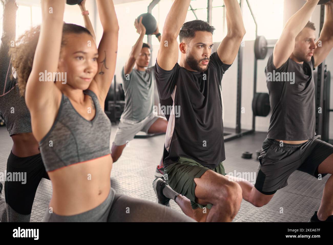 Workout class, fitness and training in a gym with diversity doing health exercise with balance. Athlete, wellness and sports group or cardio friends Stock Photo
