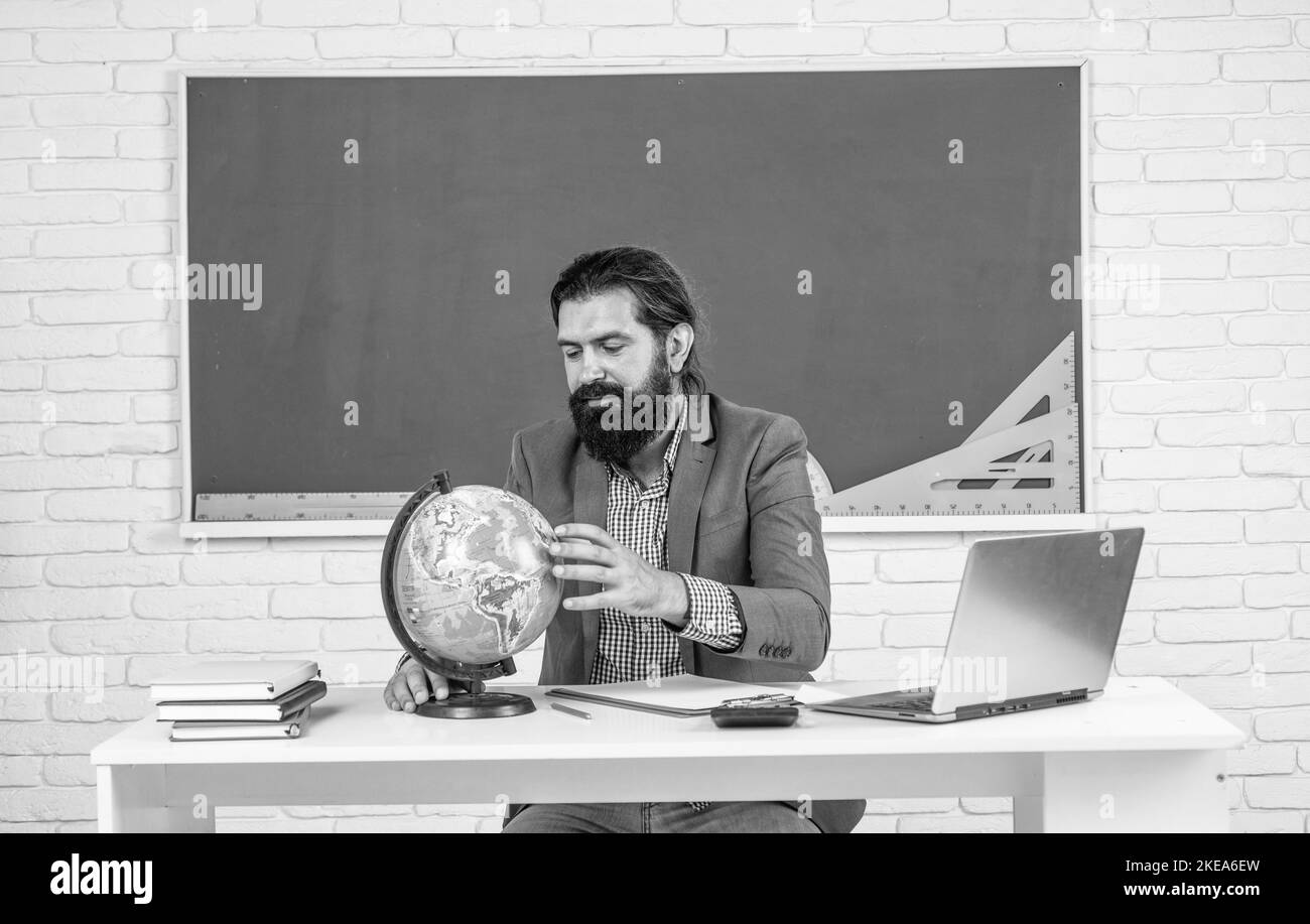 Male High School Teacher Looking On Globe Geography Stock Photo Alamy male-high-school-teacher-looking-on-globe-geography-stock-photo-alamy
