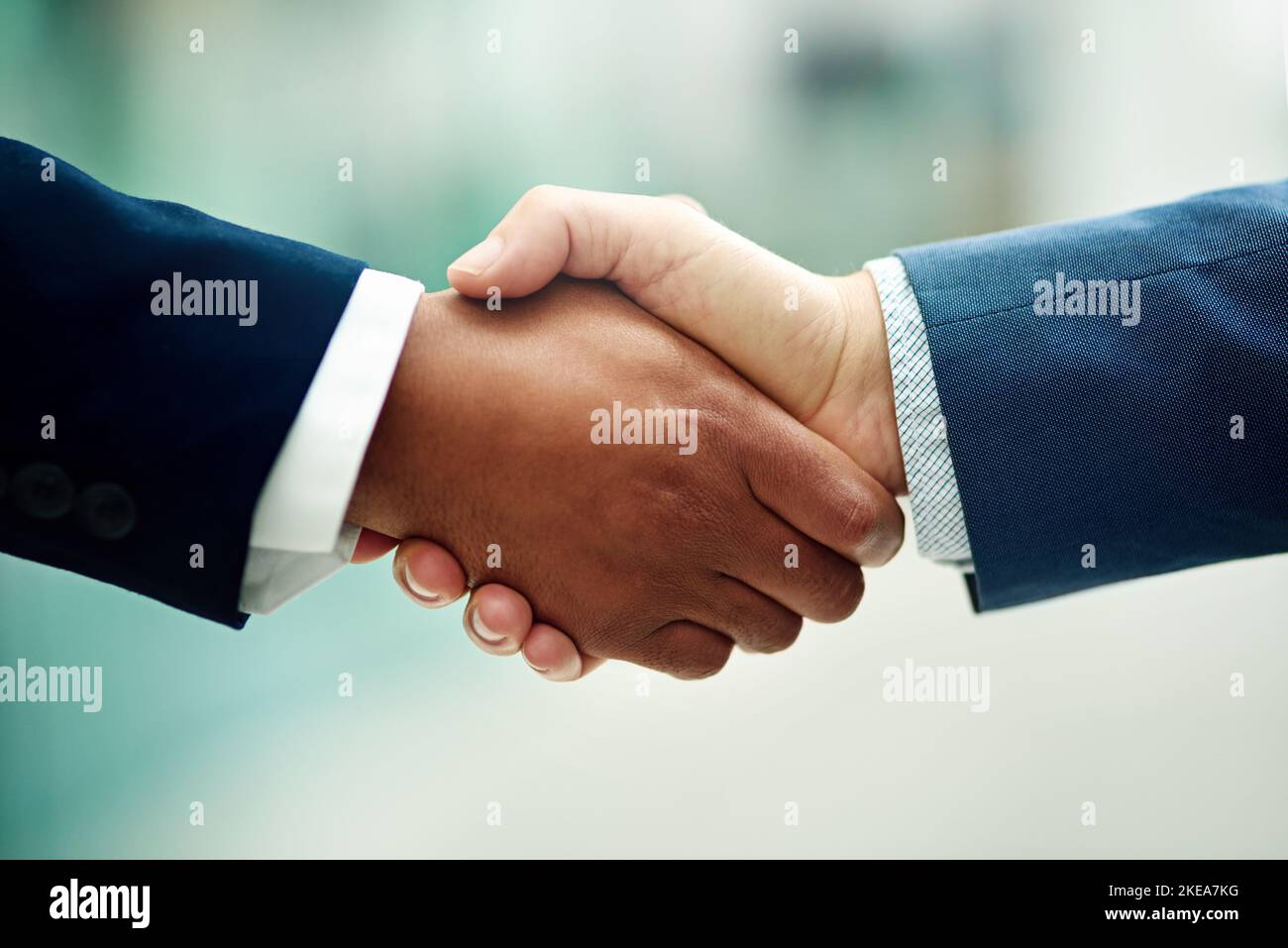 Where great collaborations start. two unidentifiable businessmen shaking hands in the office. Stock Photo