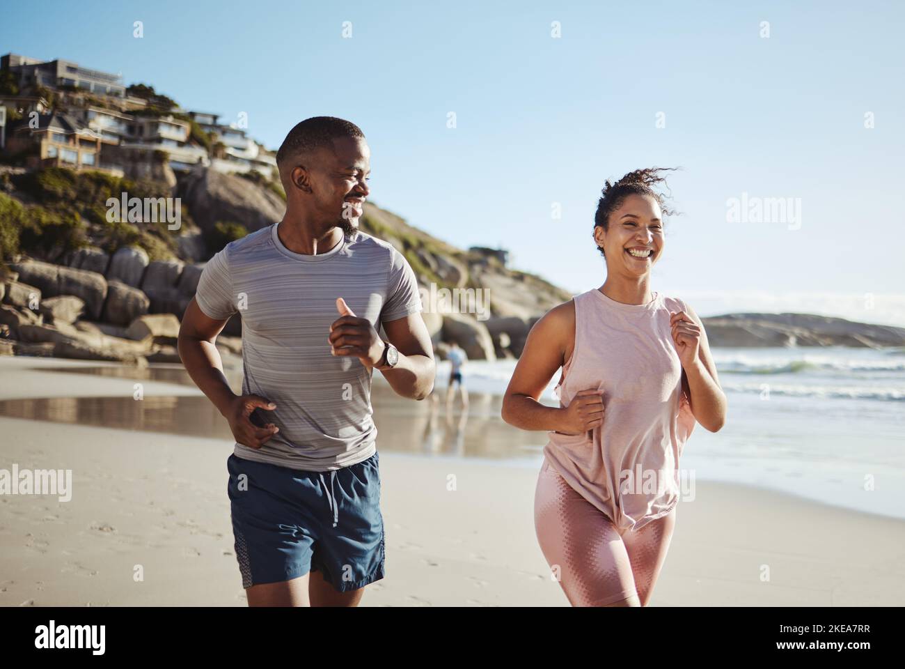 Beach fitness, running and happy black couple, friends or people workout for cardio commitment, exercise or body health. Sand freedom, peace and Stock Photo