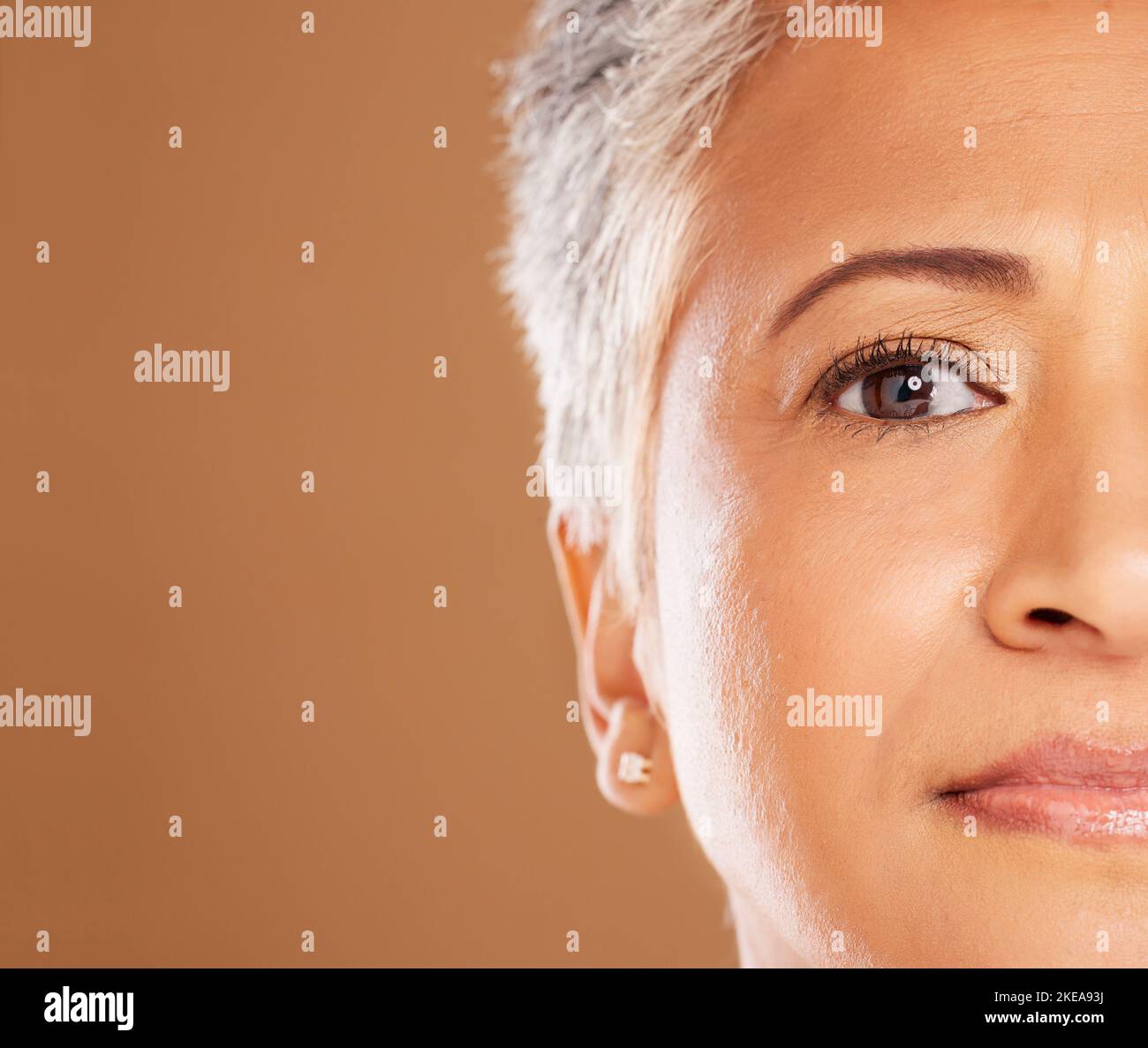 Skincare, makeup and half face of a senior woman for beauty, wellness