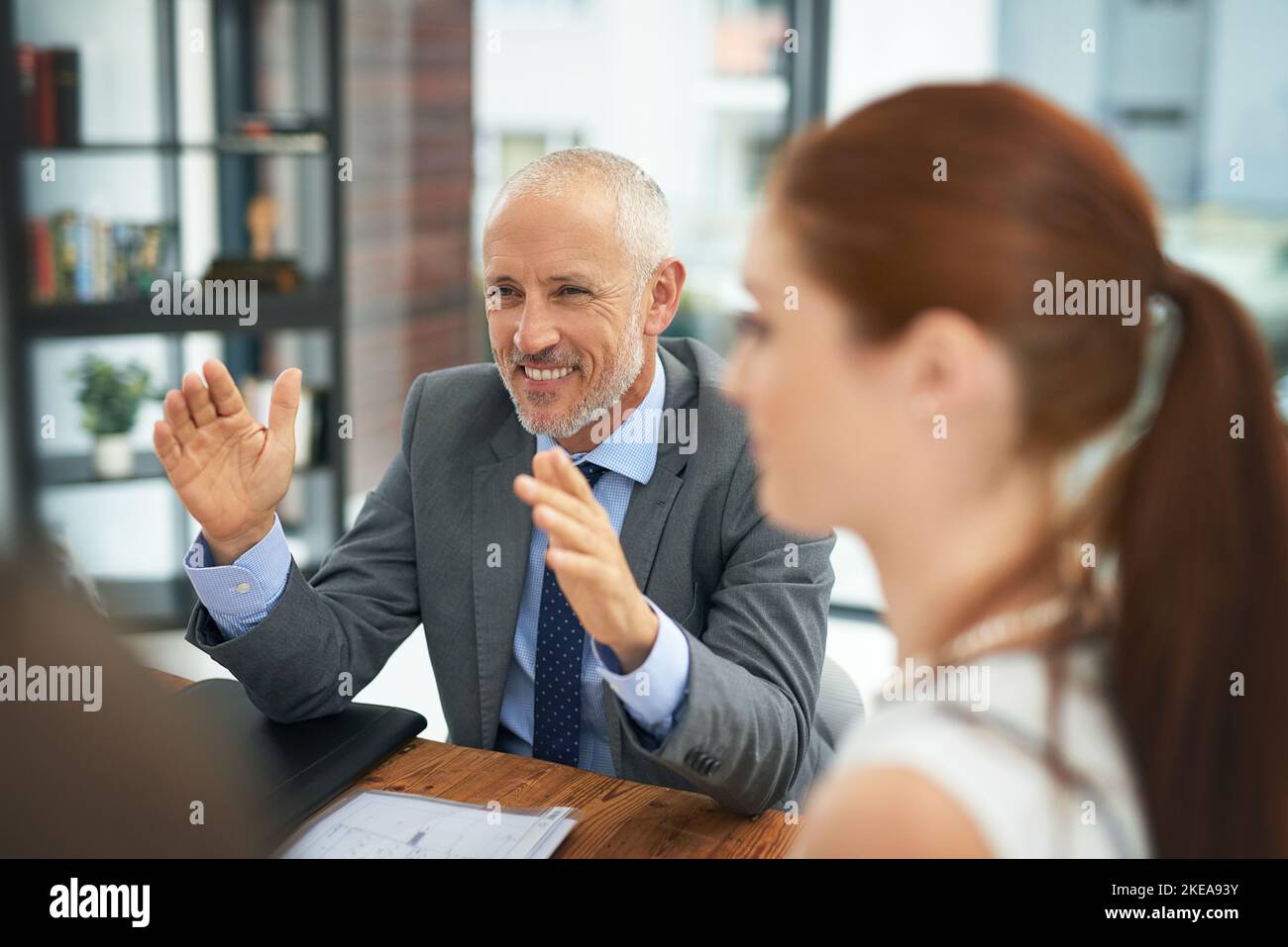 Think bigger picture. a group of businesspeople meeting in the boardroom. Stock Photo
