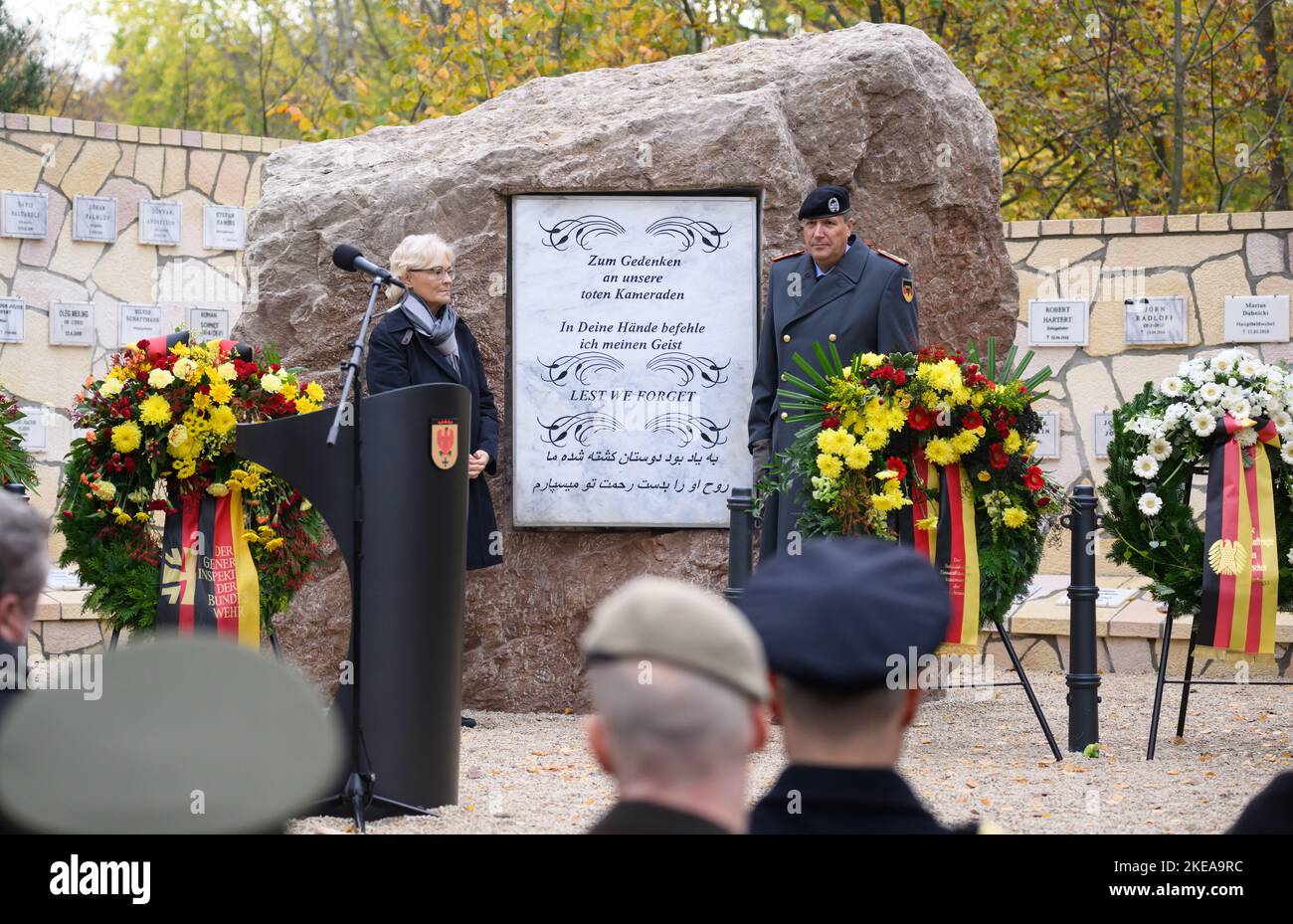 11 November 2022, Brandenburg, Schwielowsee/Ot Geltow: Christine Lambrecht (SPD), Federal Minister of Defense, and Markus Laubenthal, Lieutenant General of the German Army and Deputy Inspector General of the Bundeswehr, unveil the commemorative plaque at the opening of the rebuilt memorial grove from Camp Marmal in Mazar-i Sharif in the "Forest of Remembrance" at the Bundeswehr Operations Command. The grove of honor from Camp Marmal in Afghanistan on the grounds of the Henning von Tresckow Barracks commemorates the 59 German soldiers and the relatives of eleven nations who lost their lives in Stock Photo