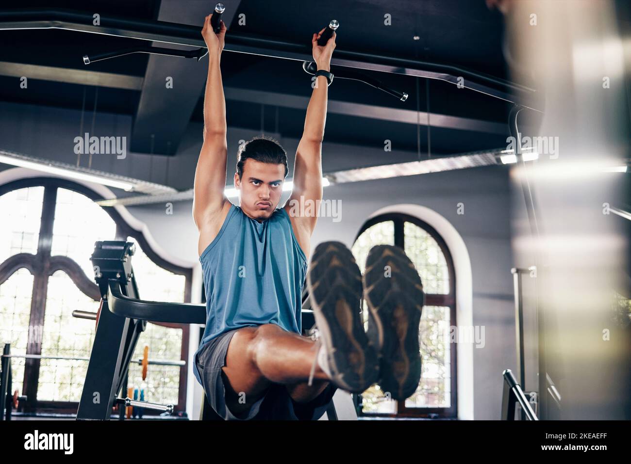 Fitness, pull ups workout and man in gym on bars training for health