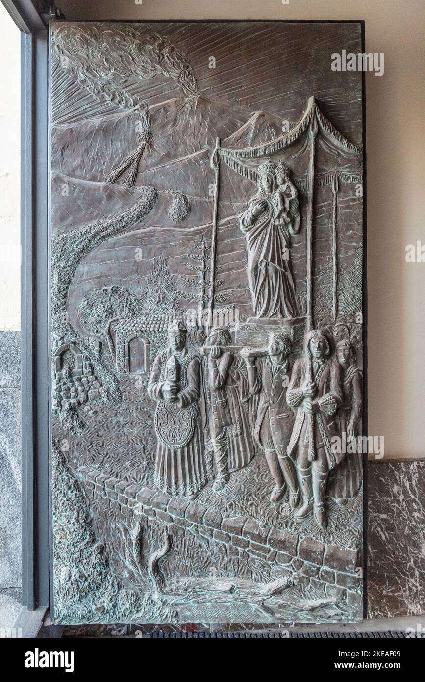 A bas-relief in the  church at Zafferana Etnea, Sicily, Italy, depicting the procession which miraculously halted the volcanic eruption of 1991-1992 Stock Photo