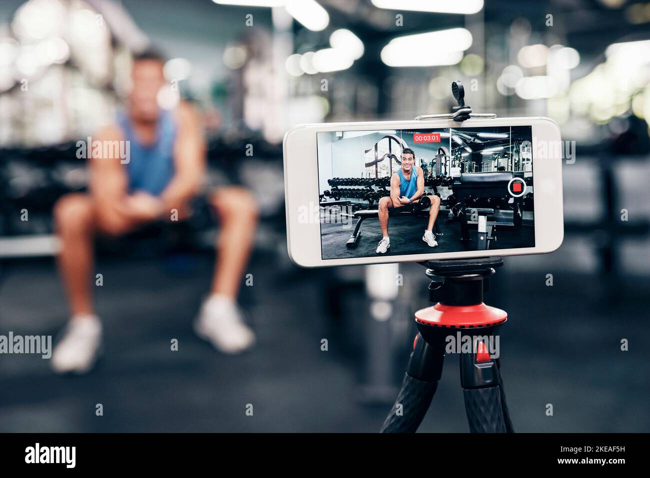 Gym, social media and fitness influencer with phone live streaming