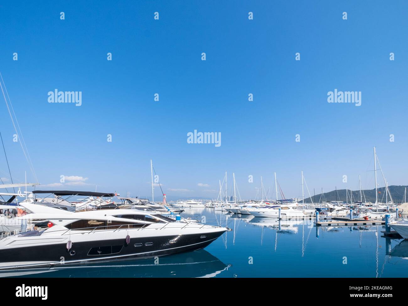 Boats parked in a blue sea under a clear sky Stock Photo - Alamy