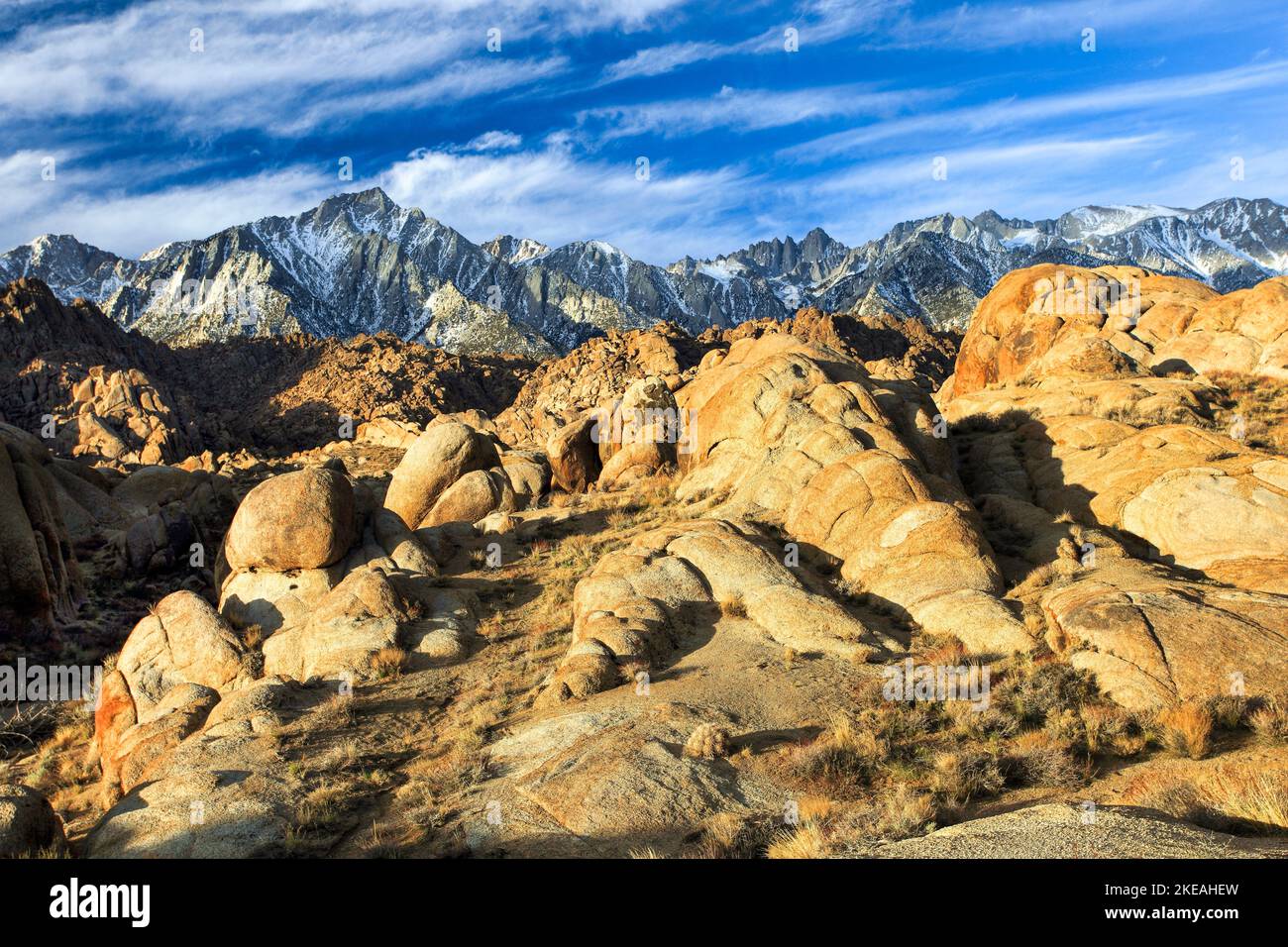 Granite boulders with the mountain chain of the Sierra Nevada in the