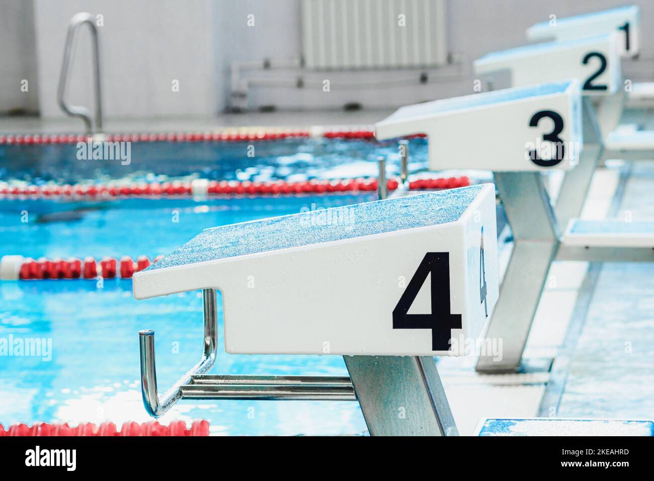 Starting table with numbers for diving in Olympic pool. Swimming pool
