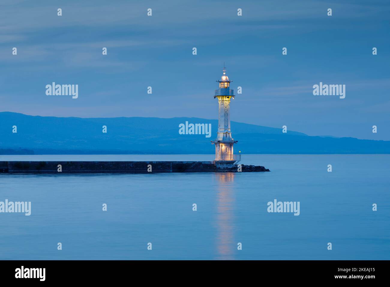 Lighthouse on shore of Lake Geneva at dusk, Switzerland, Kanton Genf, Geneva Stock Photo