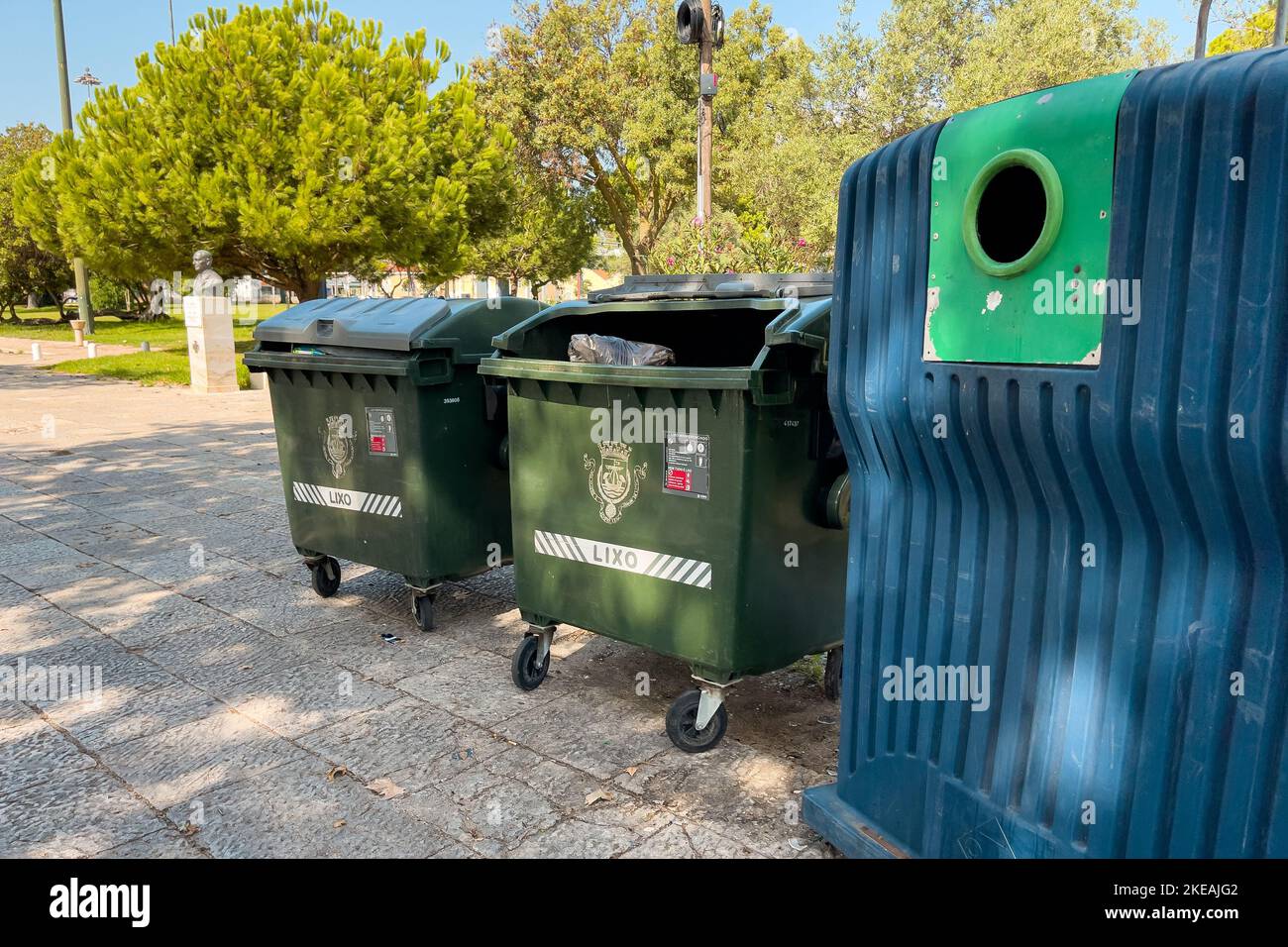 Large garbage containersA Large garbage containers outdoors outdoors