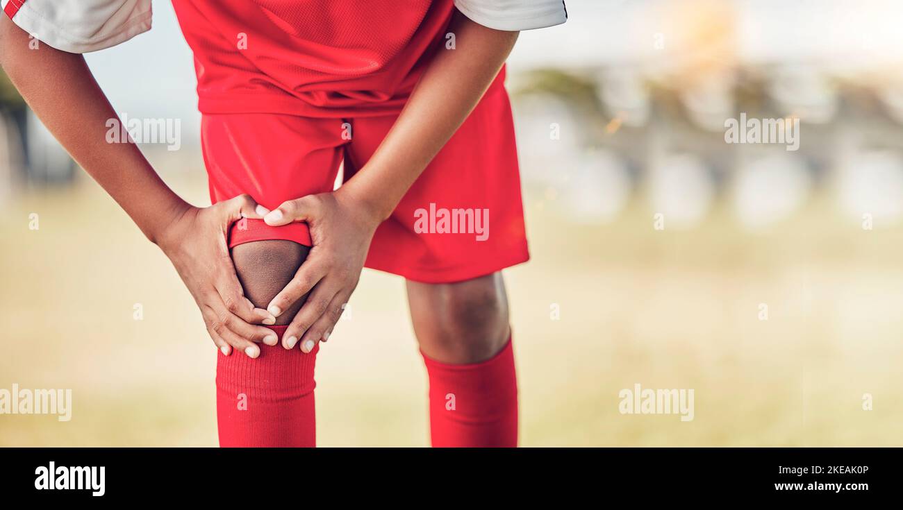 Sport, knee injury and soccer player on field, fitness and athlete have