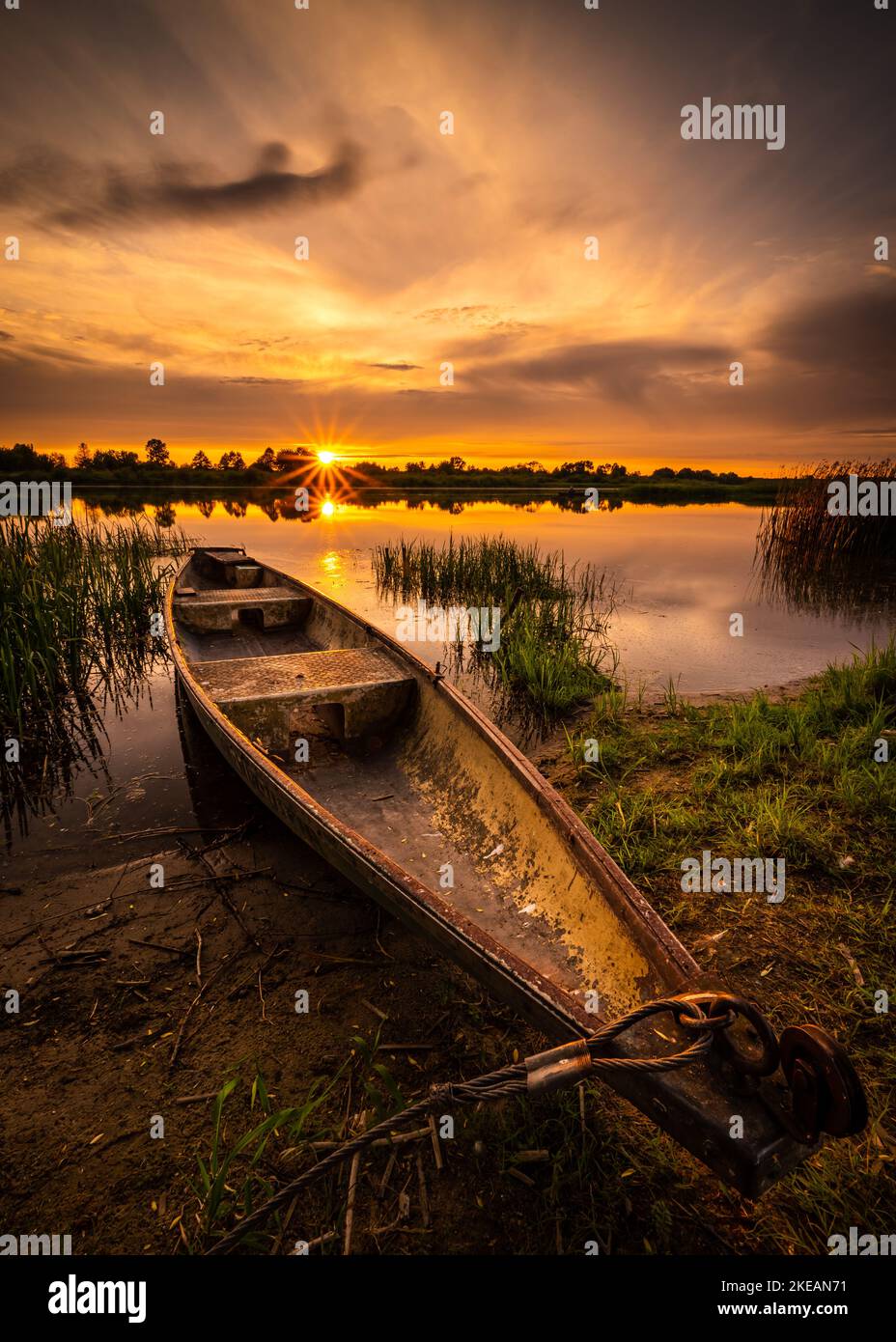 colorful and delightful sunset over the bug river. Stock Photo