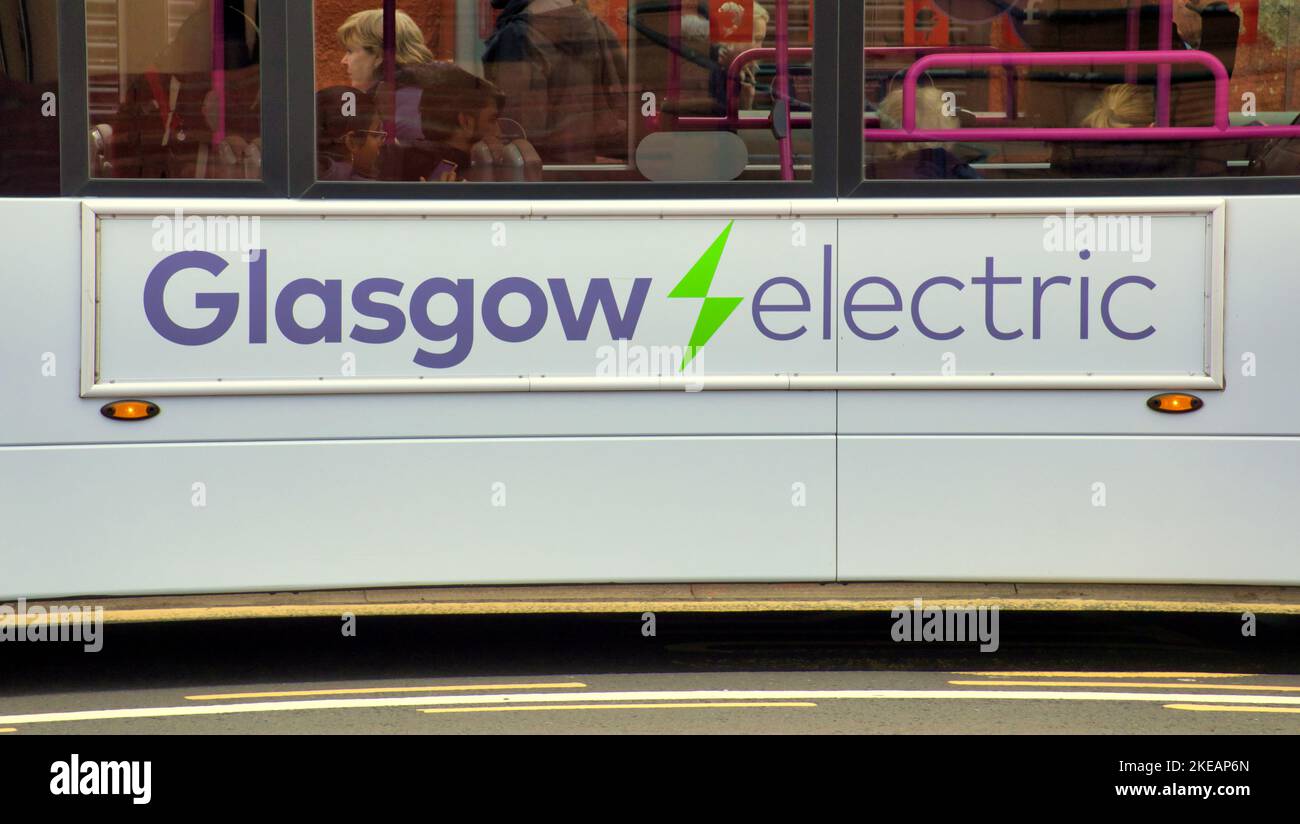first bus Glasgow  electric panel on side of vehicle Stock Photo