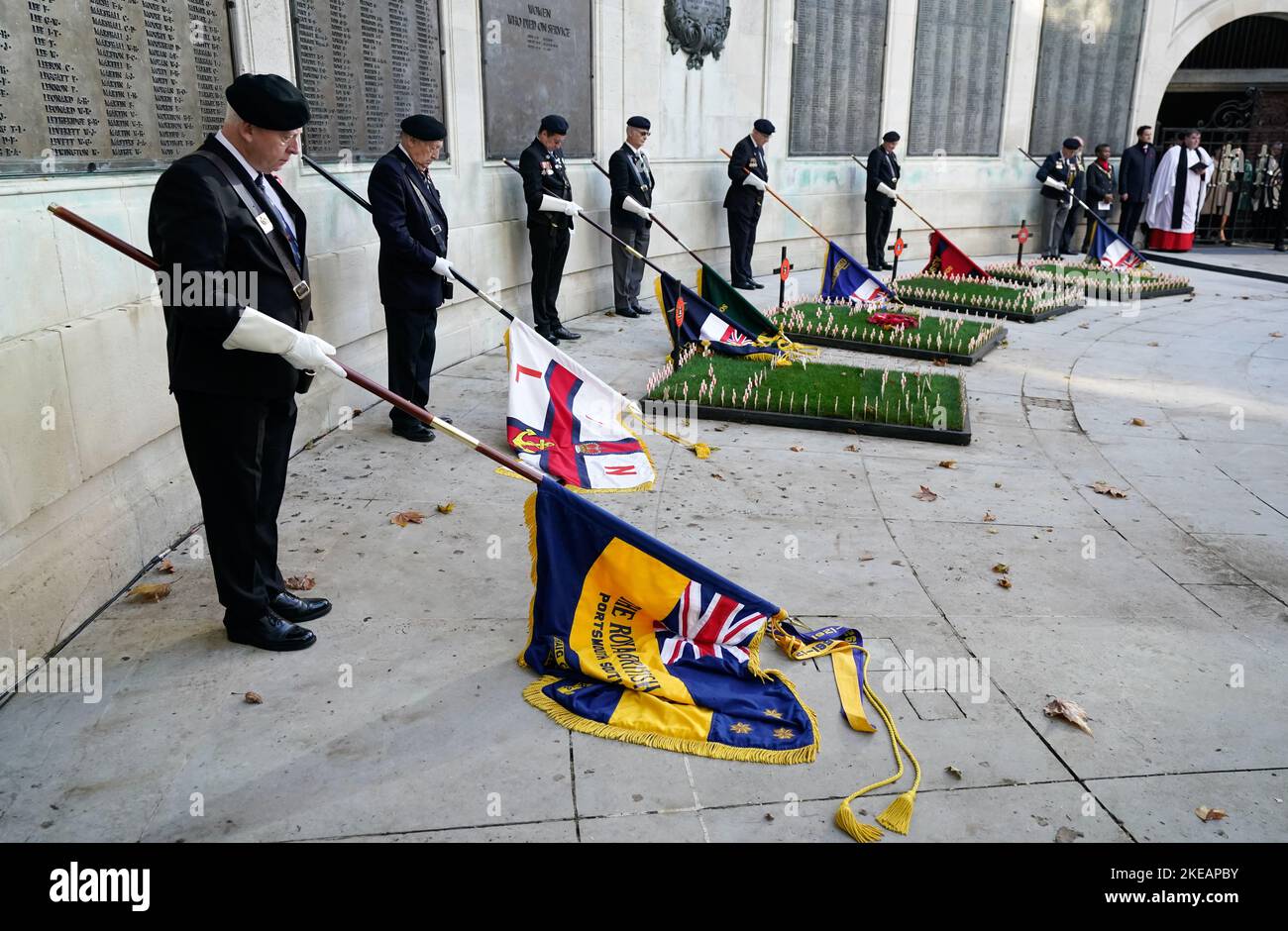 Standard bearers lower their standards at the start of a two minute