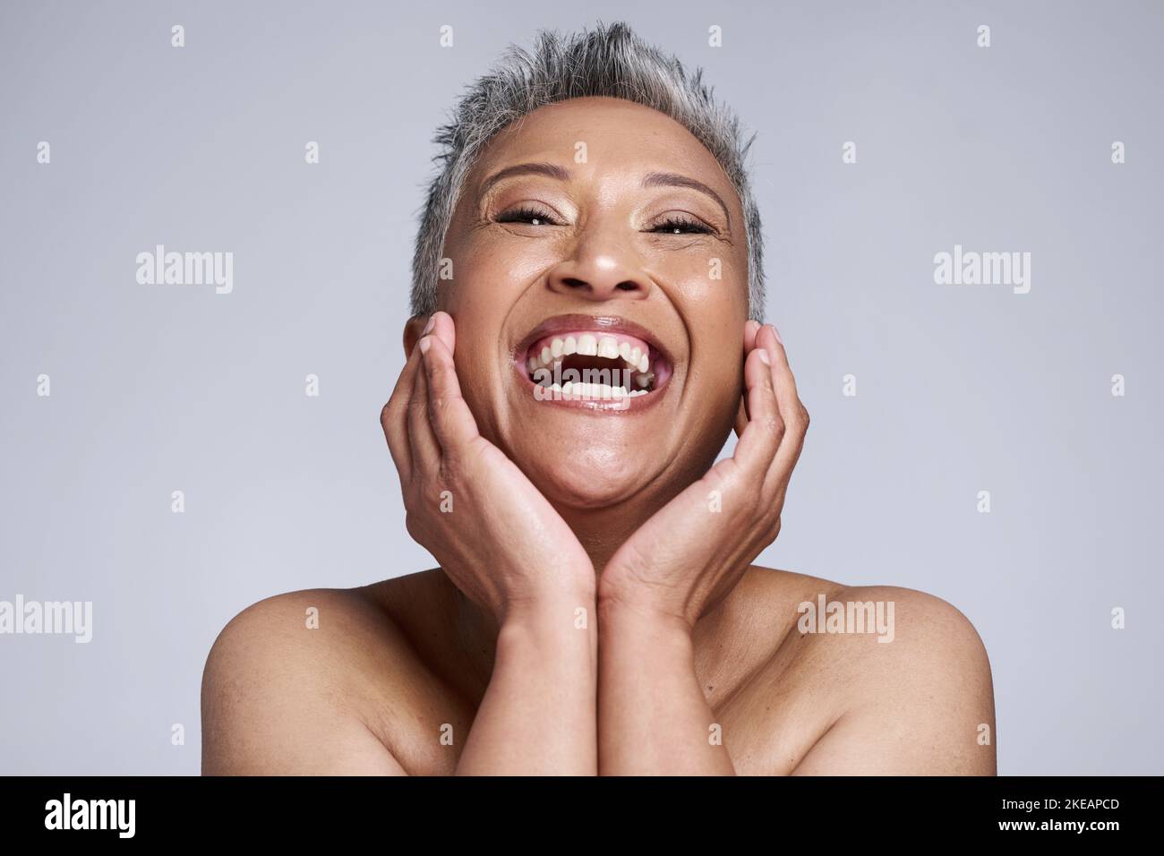 Happy, smile or skincare of senior woman in studio portrait for health, botox or natural cosmetic routine treatment. Skin facial or comic elderly Stock Photo