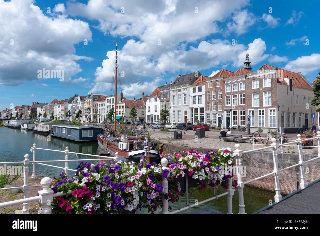 Cityscape with houseboat and traditional flat-bottomed sailing boat on Bierkaai, Middelburg, Zeeland, Netherlands, Europe Stock Photo