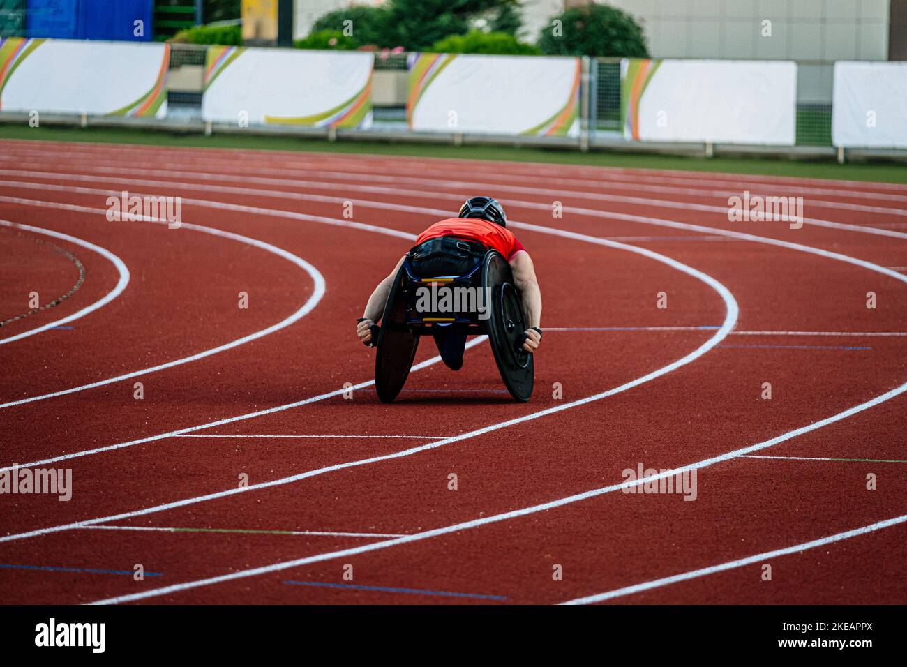 athlete in wheelchair racing competition at athletics Stock Photo