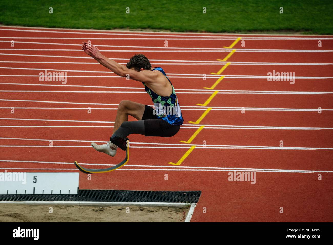 male paraathlete long jump in competition Stock Photo