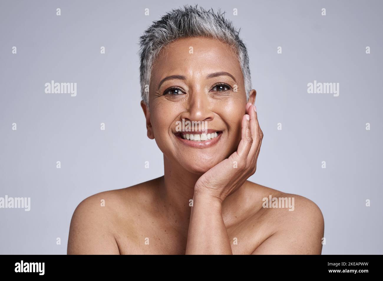 Happy senior woman, studio and beauty for skincare, makeup and smile