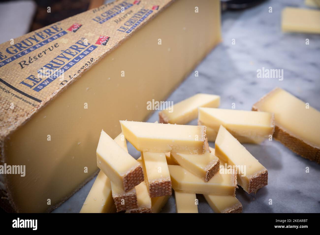 July 11 2022, Lyon, France : Switzerland cheese : Le Gruyère Réserve, famous swiss cheese in a cellar on a marbble background Stock Photo