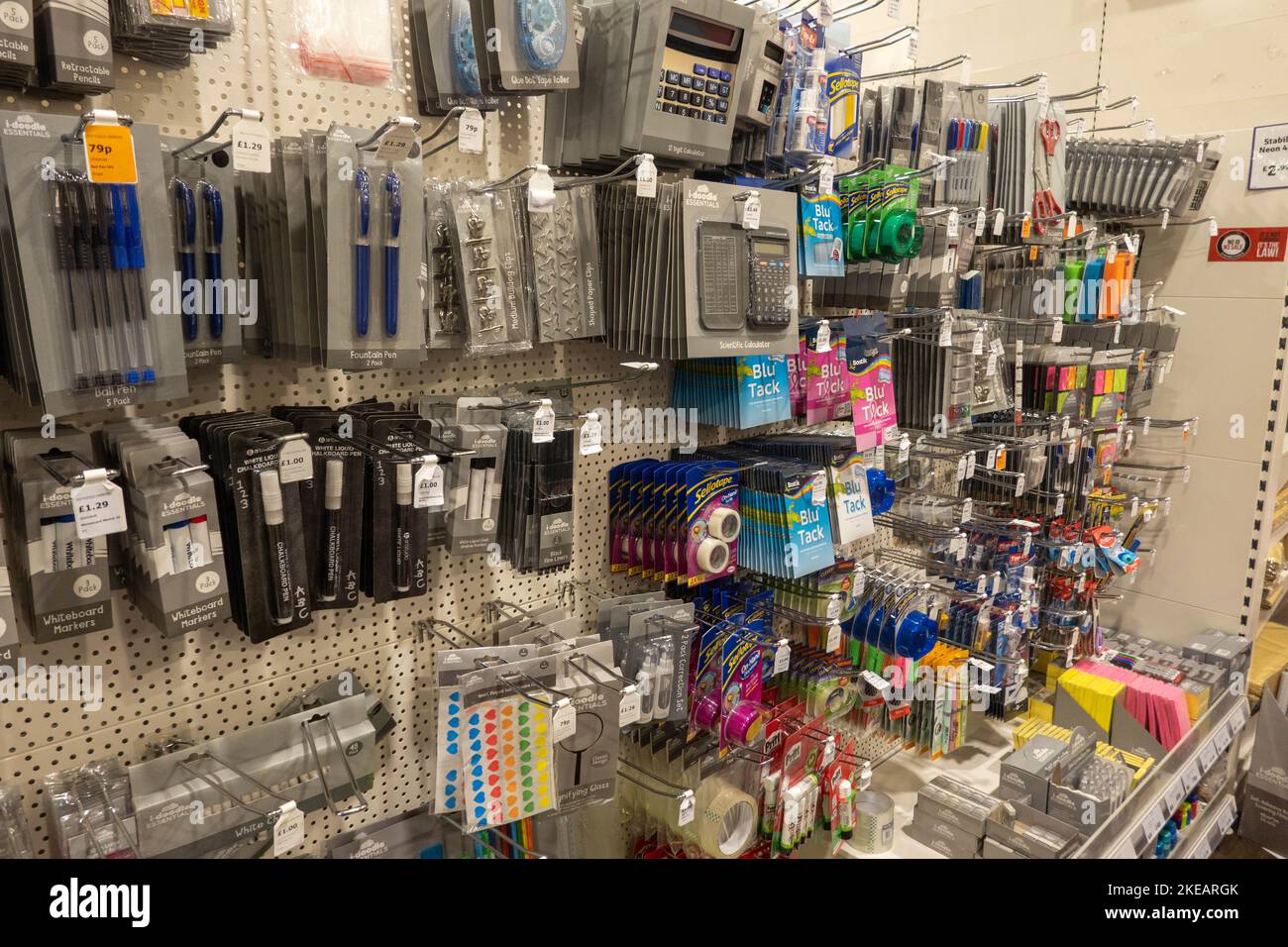 Various stationary items I.e. pens,pencils tape on hooks and shelves at