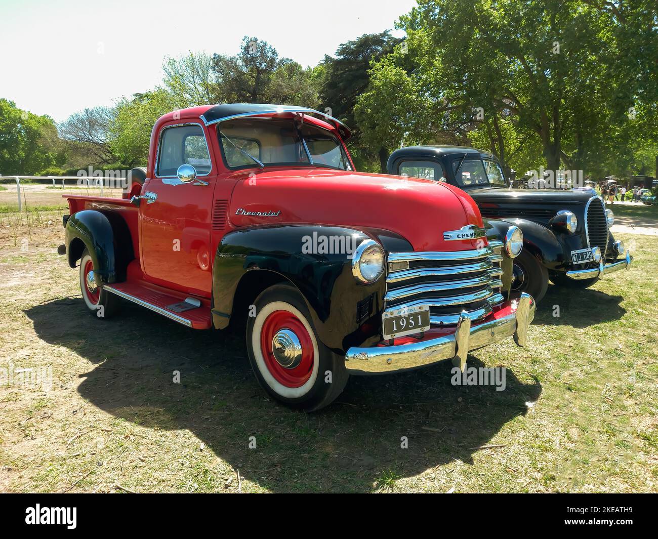 Old red and black 1951 Chevrolet Chevy 3100 pickup truck Advance Design by GM. Sunny day in the countryside. Autoclasica 2022 classic car show. Stock Photo