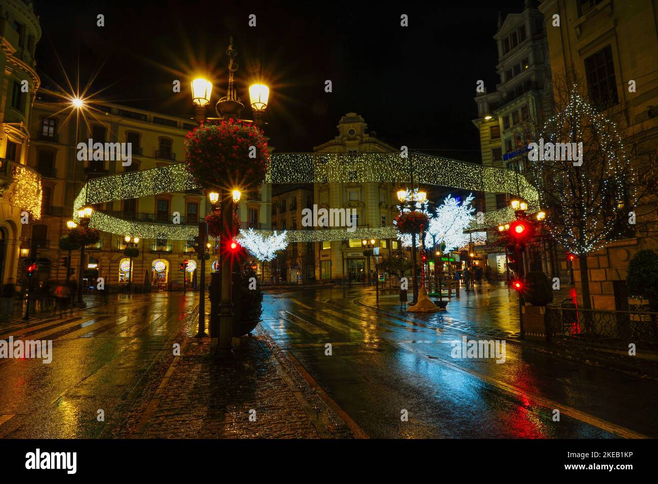 Rainy night in the city of Granada and its streets adorned with