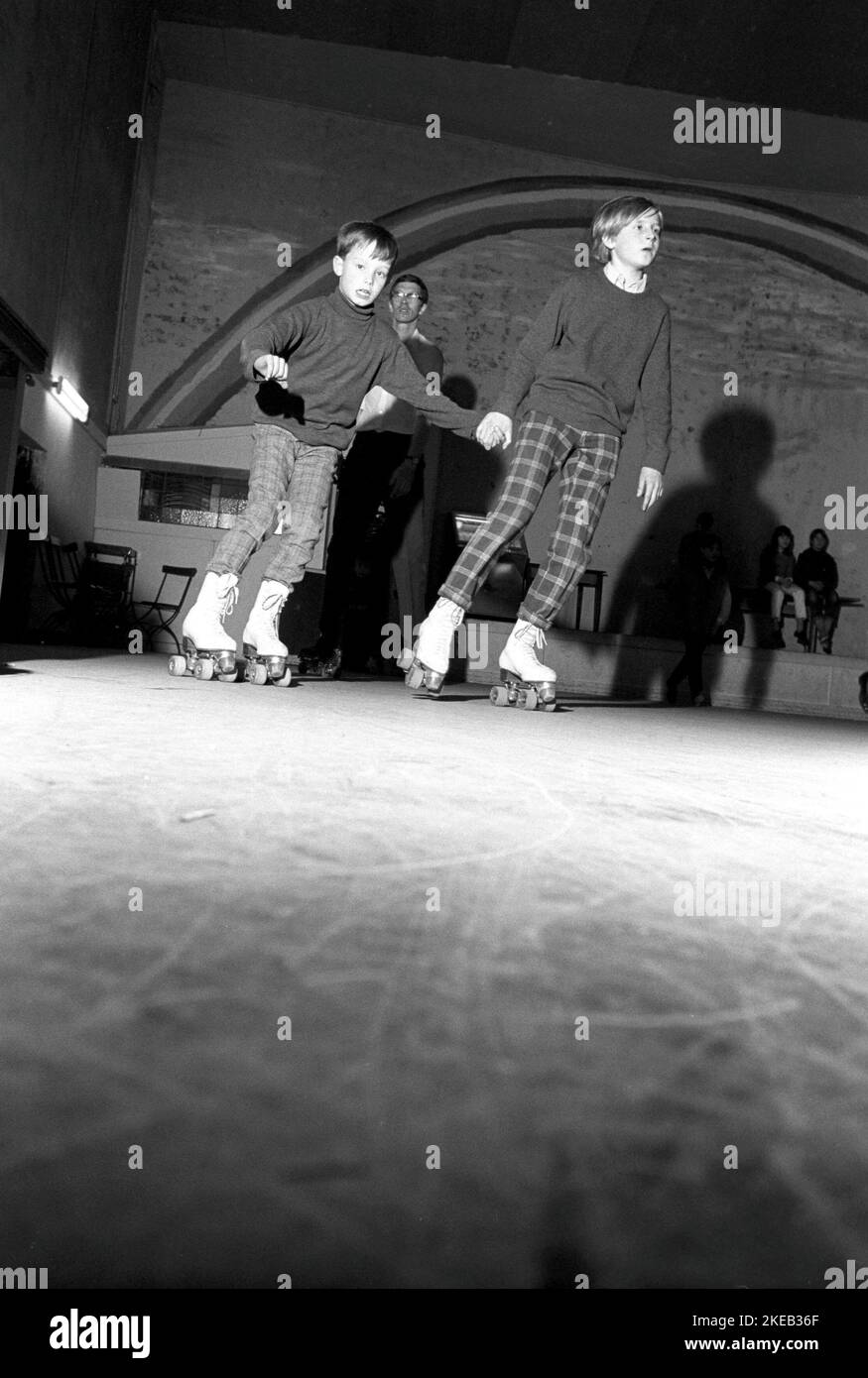 Roller skate fun in the 1960s. Interior of a roller disco with people